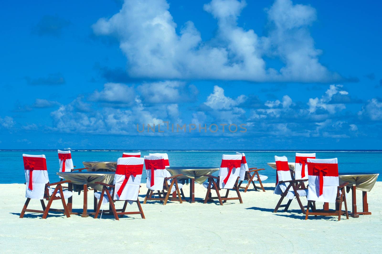 Romantic luxury dinner or lunch setting at tropical beach in Maldives