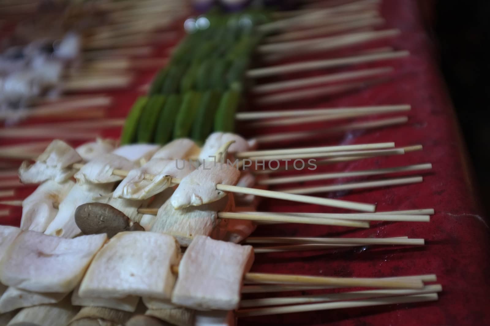 Asian street food Grilled with Chinese Sichuan Peppers (Ma-la) style , Seller prepare for meals, balls, seafoods and vegetables grill with Sichuan pepper.Thai Street food