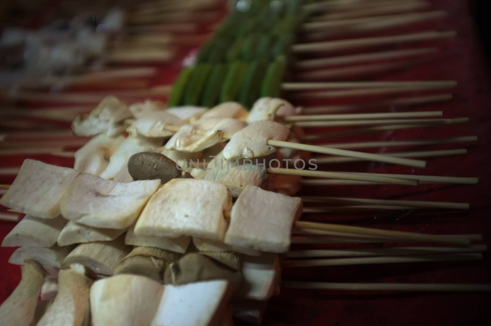 Asian street food Grilled with Chinese Sichuan Peppers (Ma-la) style , Seller prepare for meals, balls, seafoods and vegetables grill with Sichuan pepper.Thai Street food