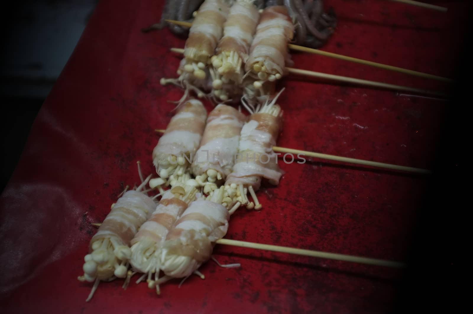 Asian street food Grilled with Chinese Sichuan Peppers (Ma-la) style , Seller prepare for meals, balls, seafoods and vegetables grill with Sichuan pepper.Thai Street food