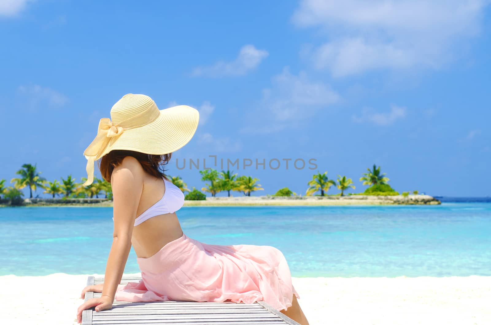Portrait of happy young woman at  Maldives island. Travel and Vacation. 