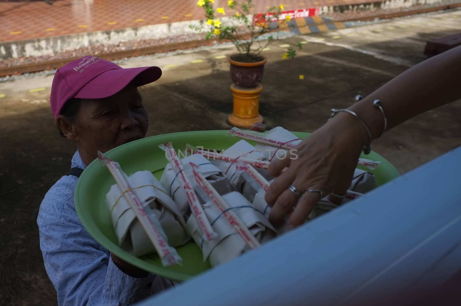 Phrae  , Thailand : September 13 2019 : The vendor on the Thai train sell Red pork noodles at Ban Pin Railway Station