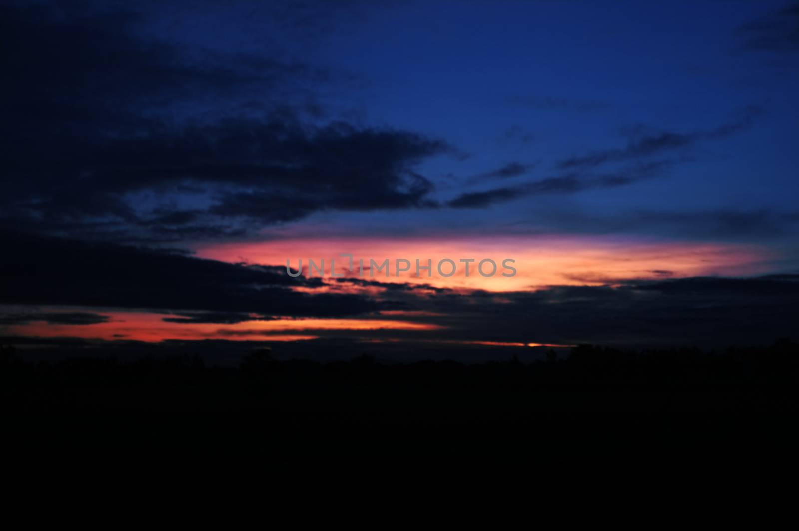 A colorful sunup above a small train station in thailand , Effect saturation