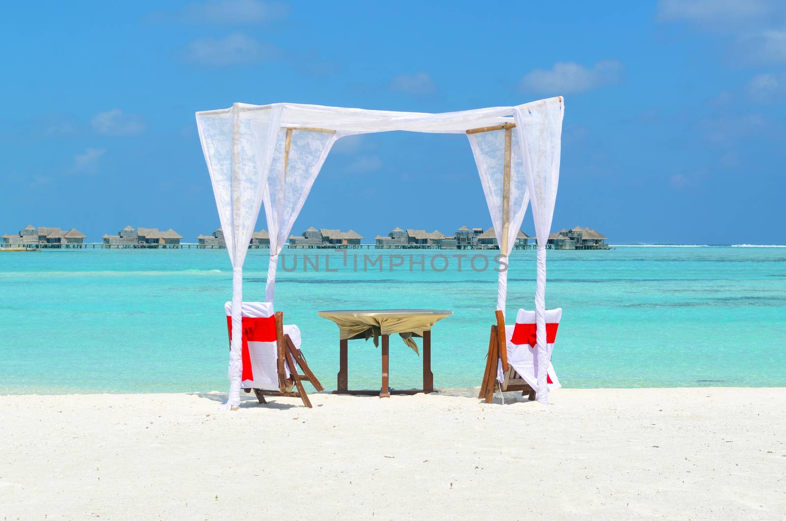 romantic luxury lunch setting at tropical beach in Maldives