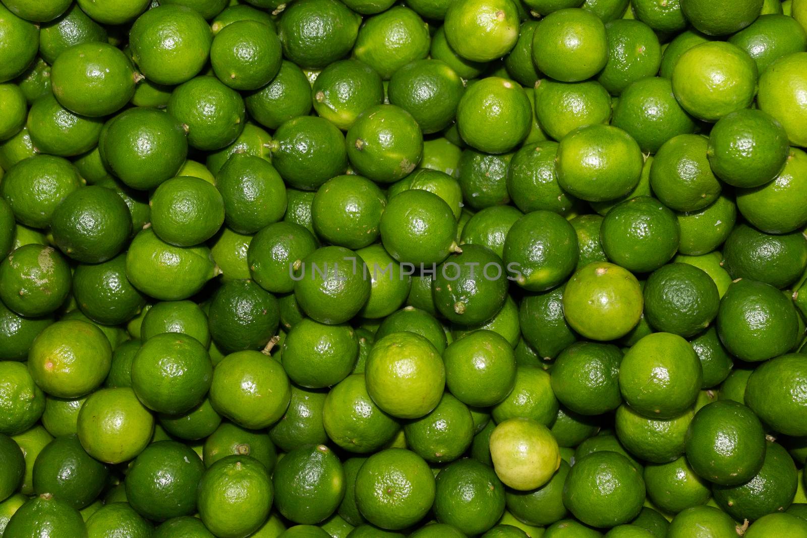 Fresh green lemons. textures and backgrounds