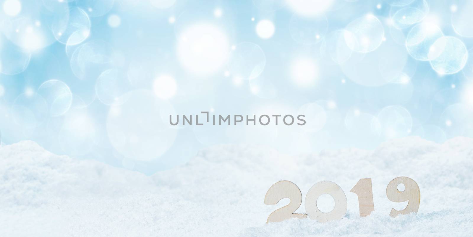 2020 New Year in snow design concept. Wooden 2020 New Year horizontal template with blue and white bokeh backgound