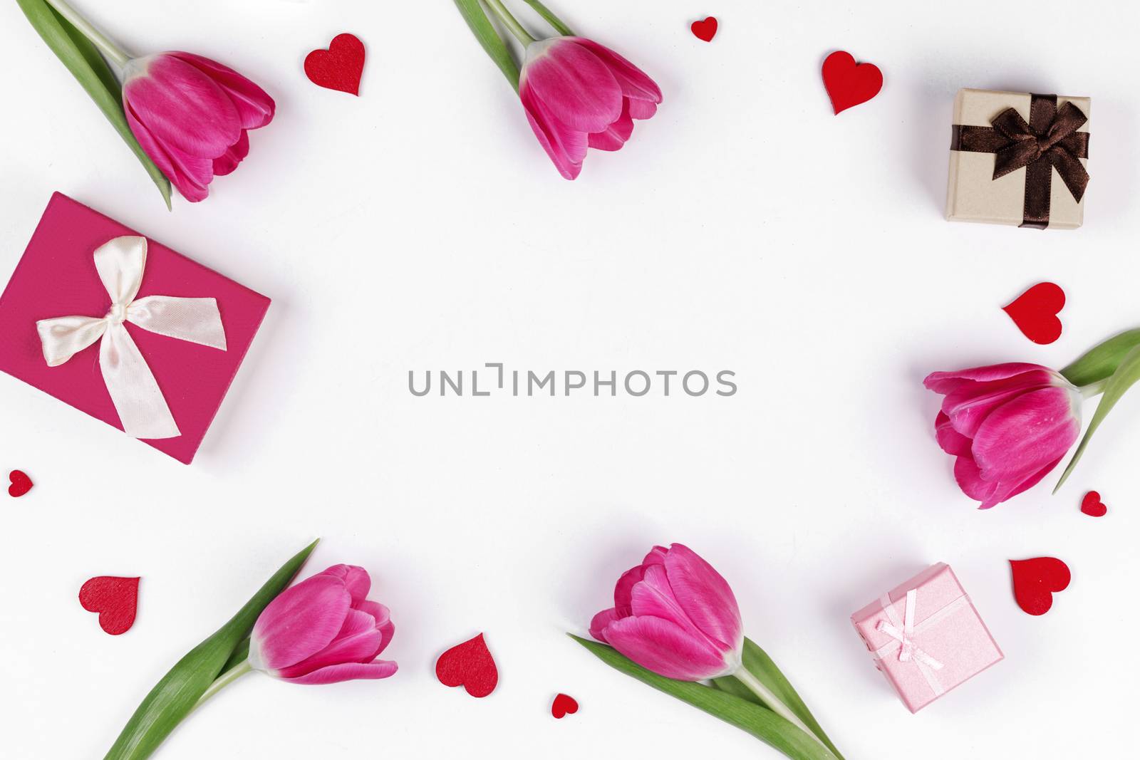 Pink tulips gifts and hearts border frame with copy space isolated on white background Valentines day concept