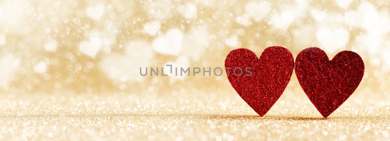 Two handmade wooden red hearts on beautiful bokeh background. Vintage style. Love Valentine's Day concept.