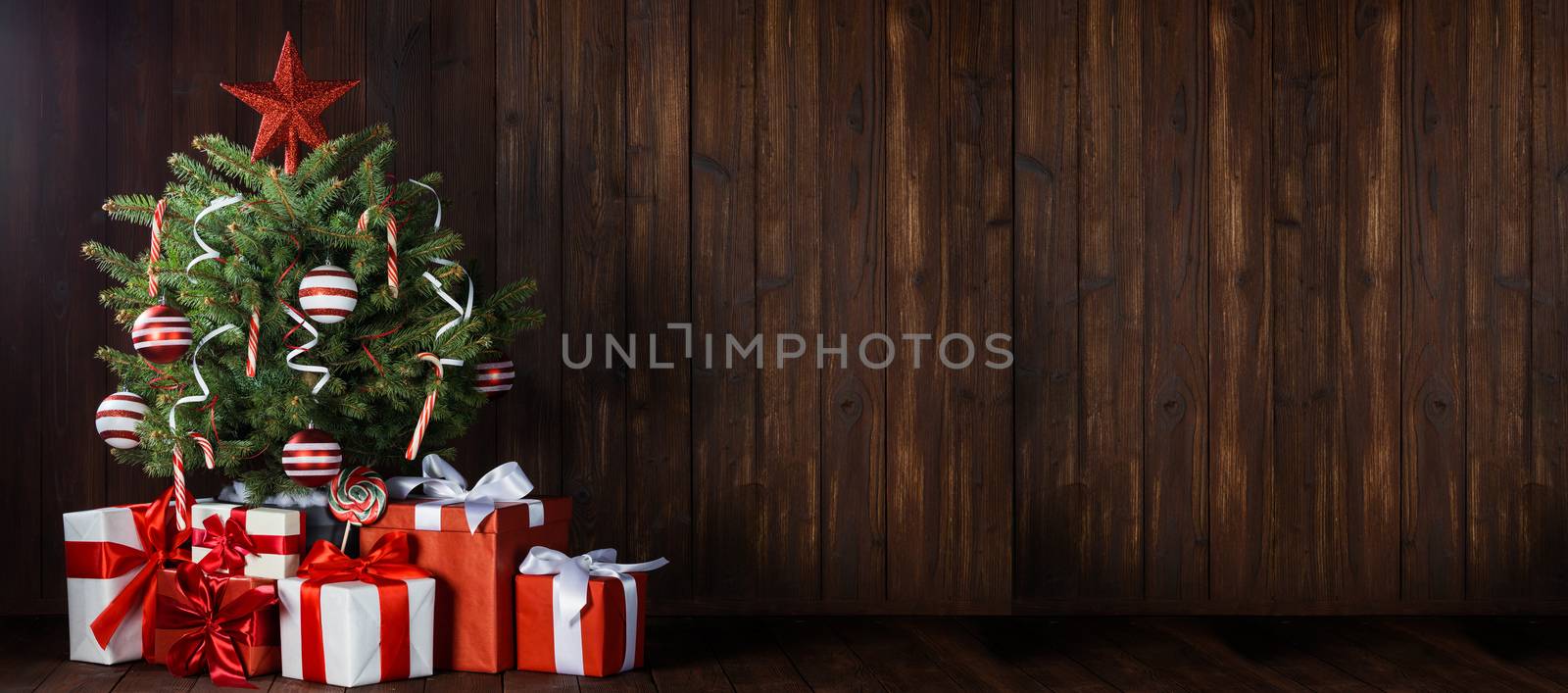 Beautiful small decorated Christmas Tree and many gifts