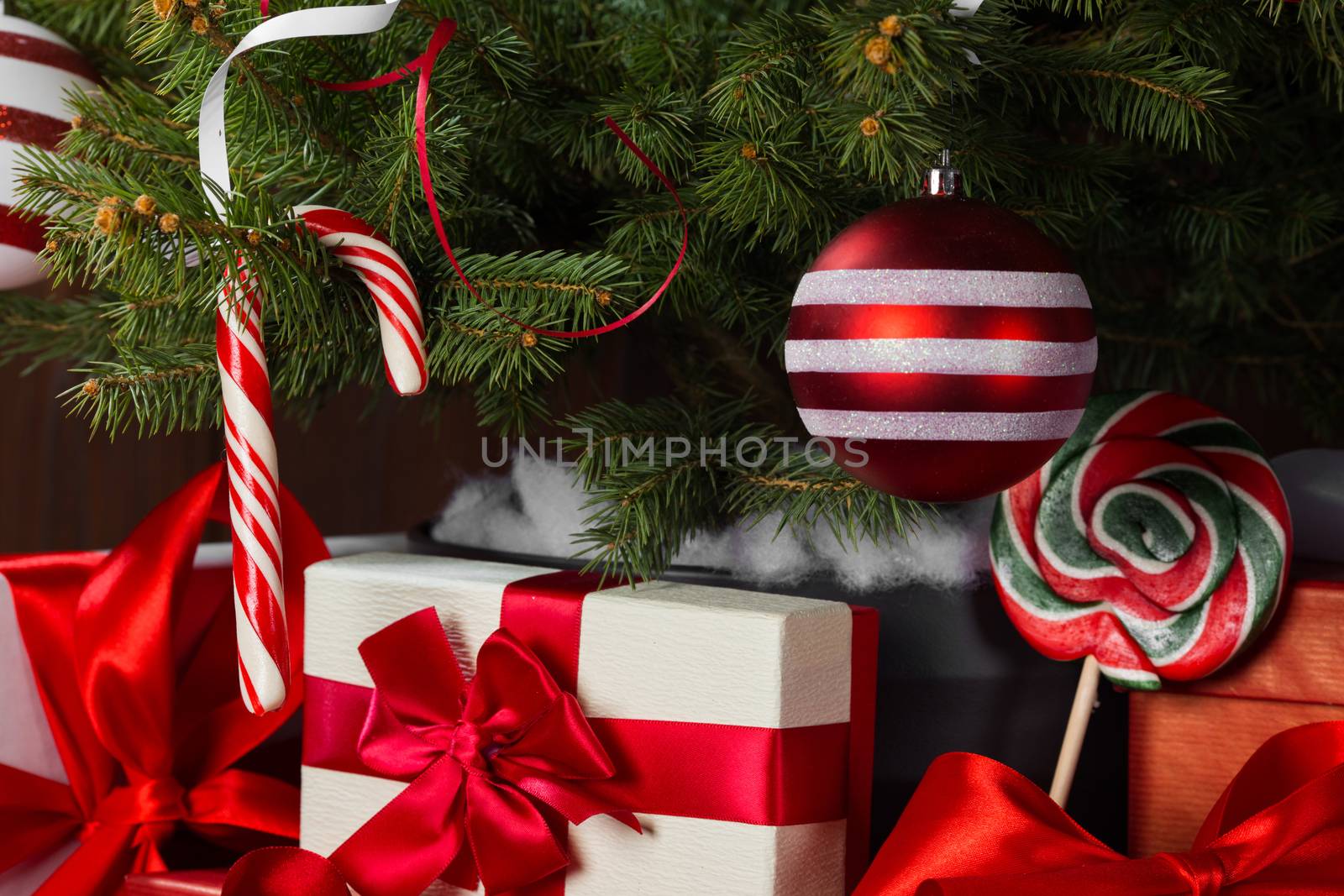 Decorated Christmas tree and gift boxes background