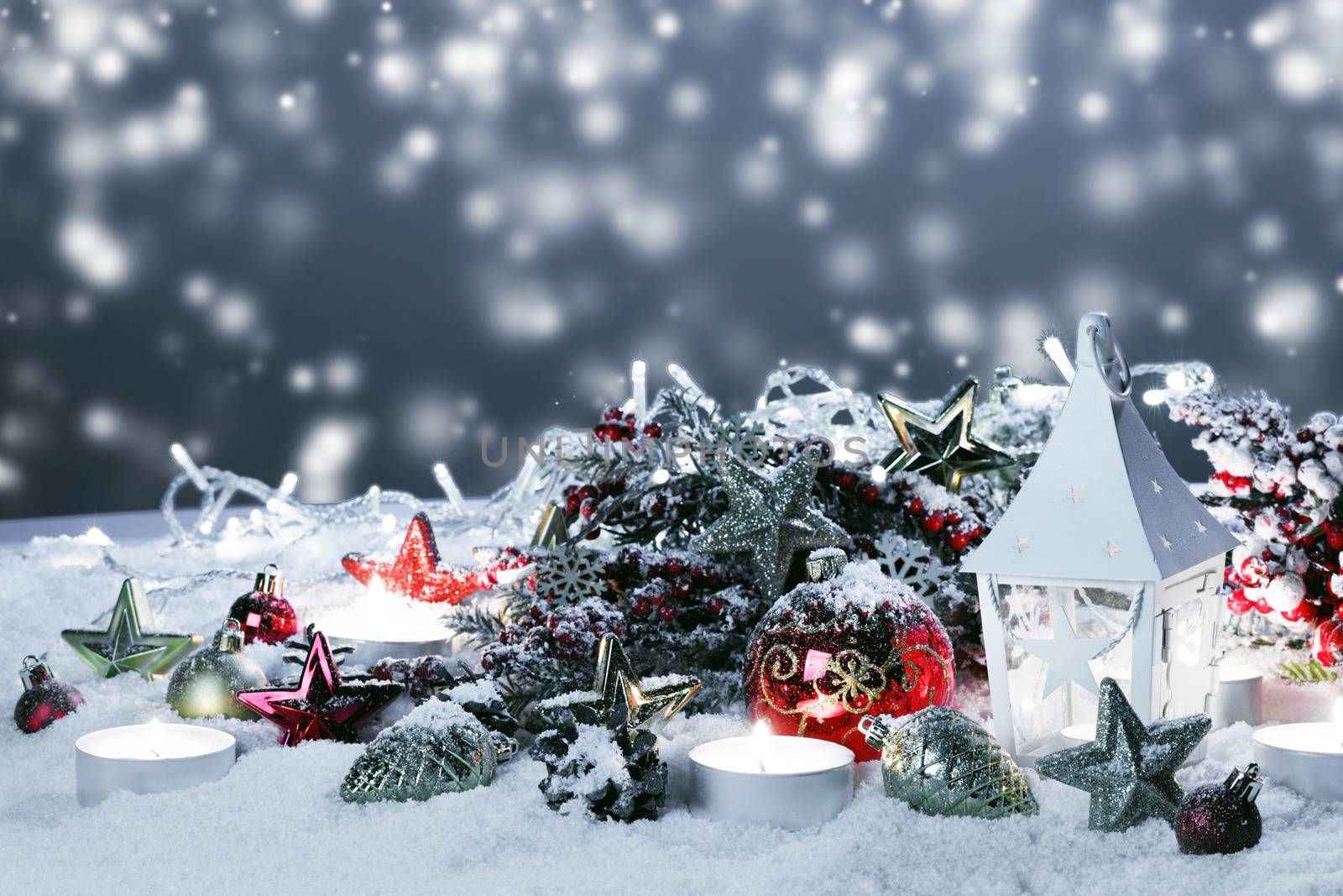 Christmas holidays card with gifts , balls and glowing lantern in snow