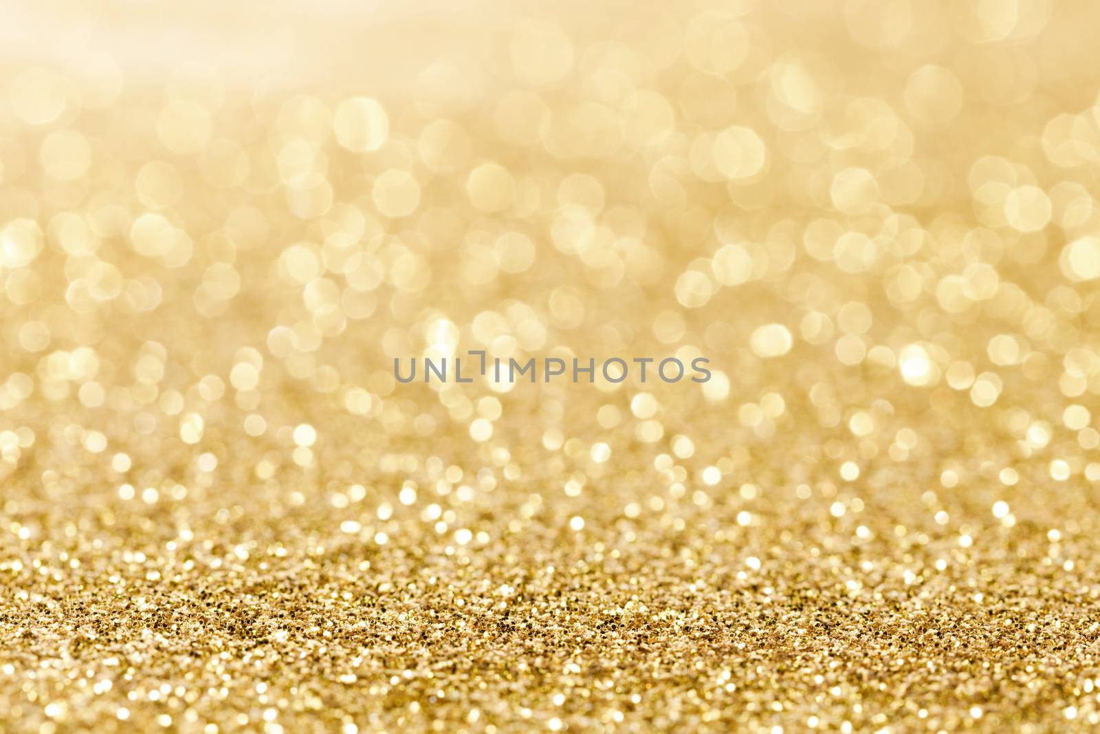 Shiny golden bokeh glitter lights abstract background, Christmas New Year party celebration concept