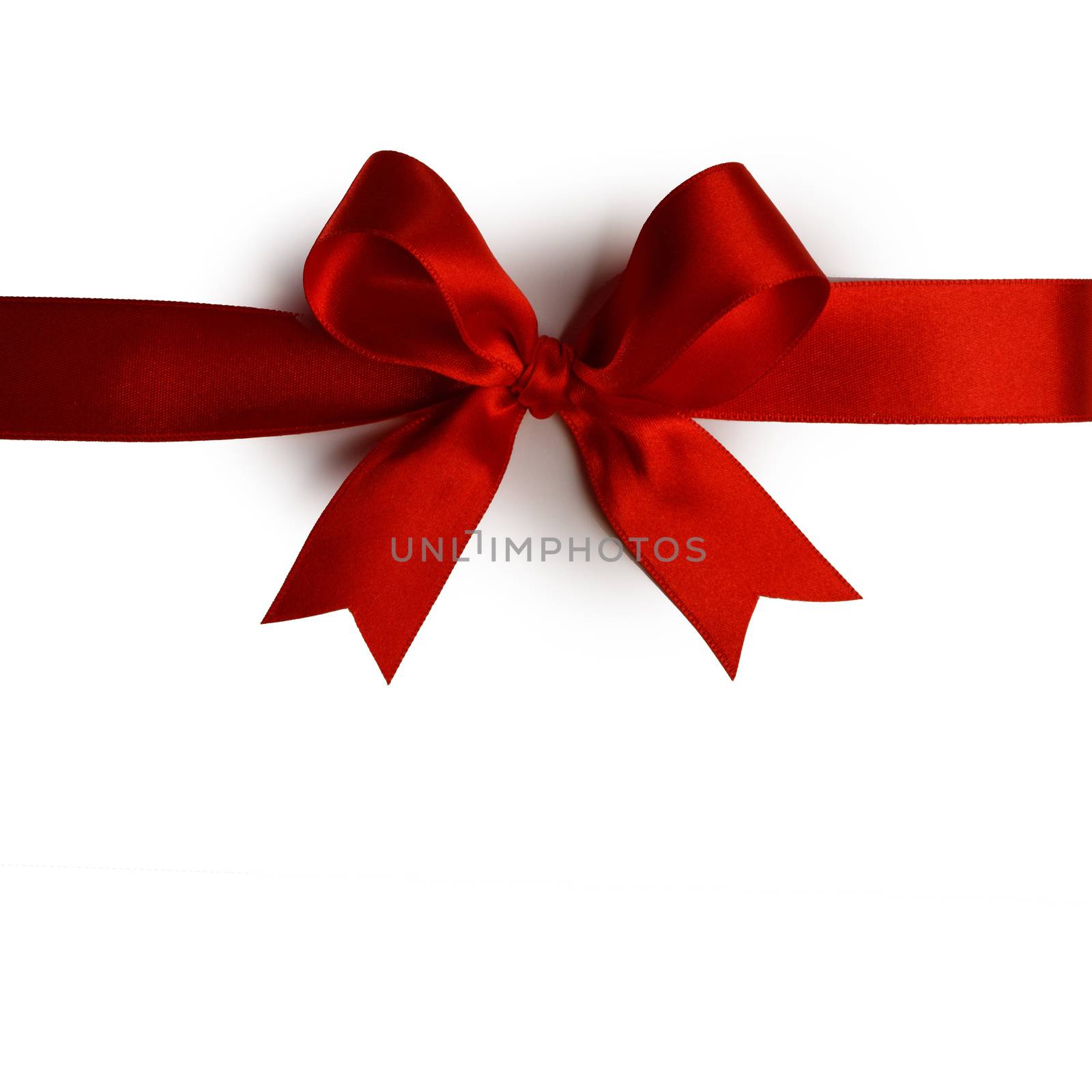 Red gift bow on white by Yellowj