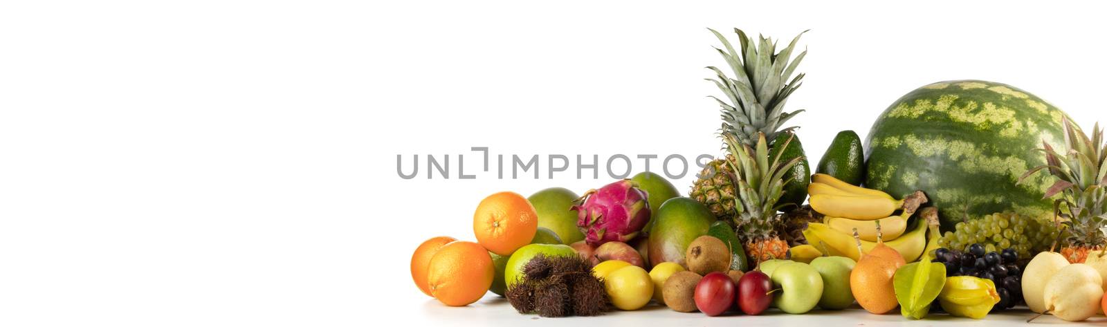 Fresh tropical fruits harvest pile isolated on white background with copy space for text