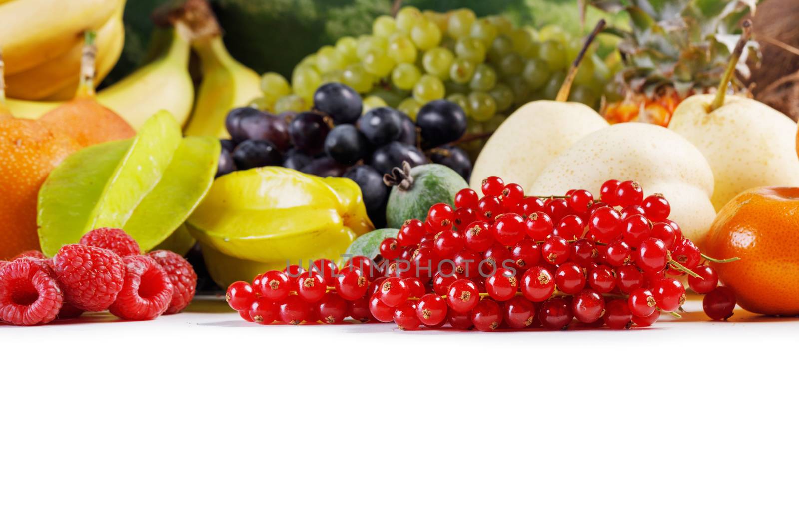 Fresh tropical fruits harvest pile isolated on white background with copy space for text