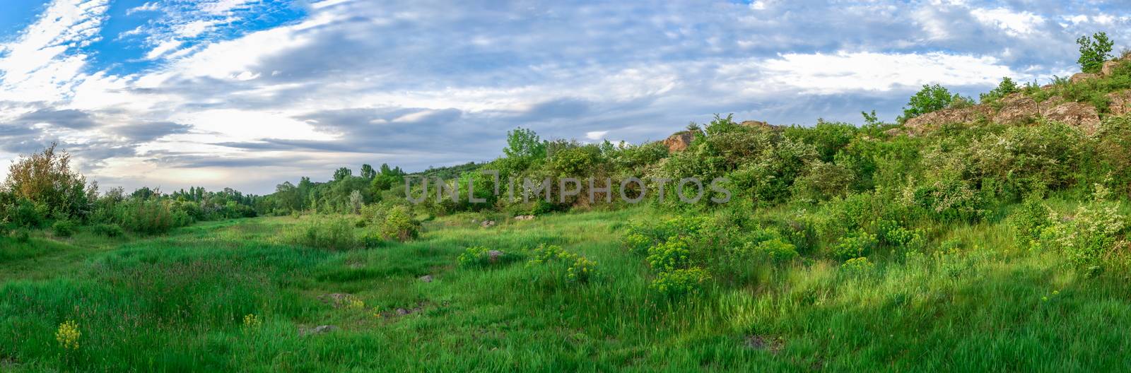 The rocky banks of the Southern Bug River near the village of Migiya in Ukraine on a sunny summer day