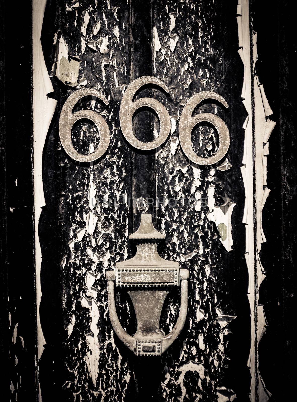 A Scary Door With The Number 666 And Black Peeling Paint For Halloween