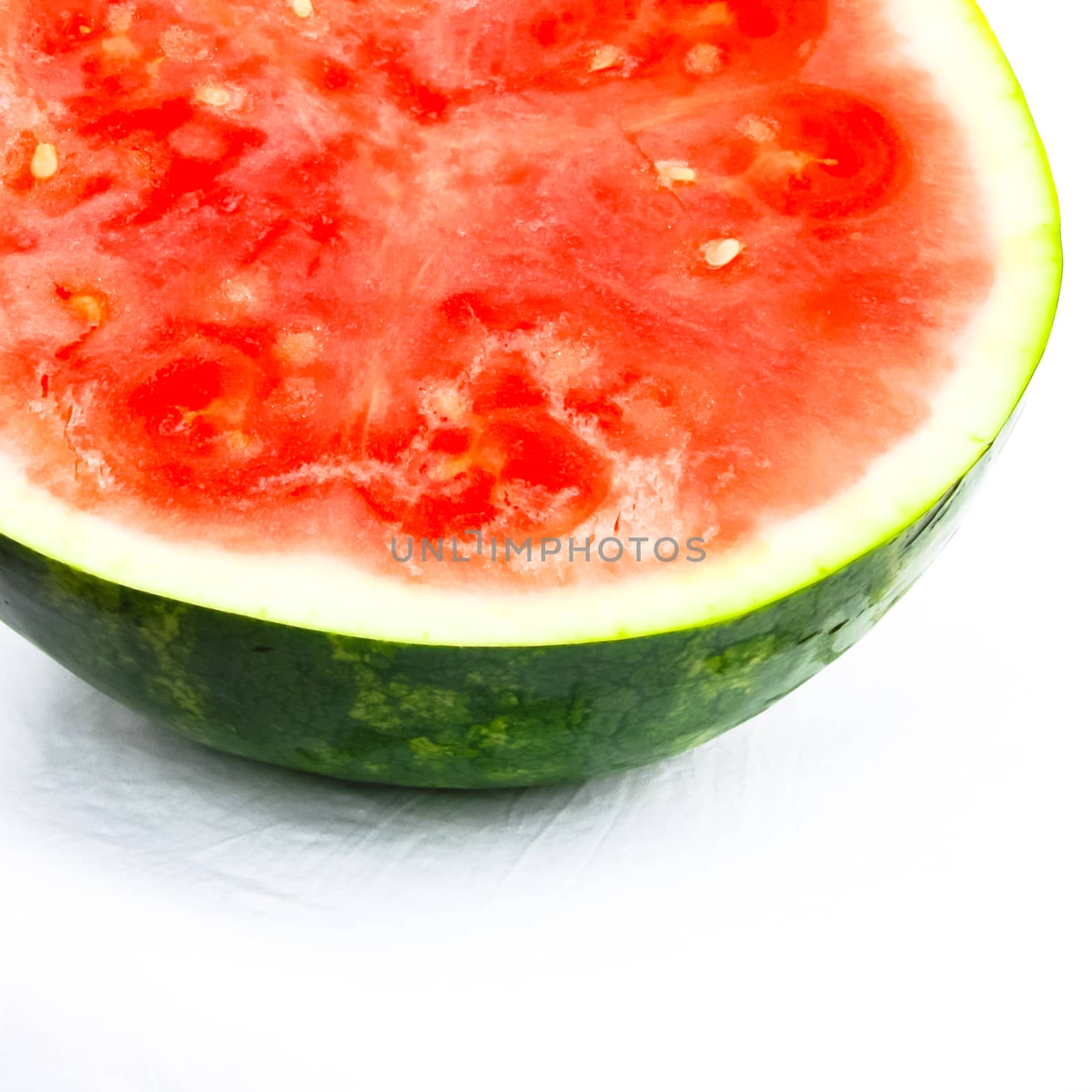 Studio shot half cut of organic watermelon isolated on white by trongnguyen