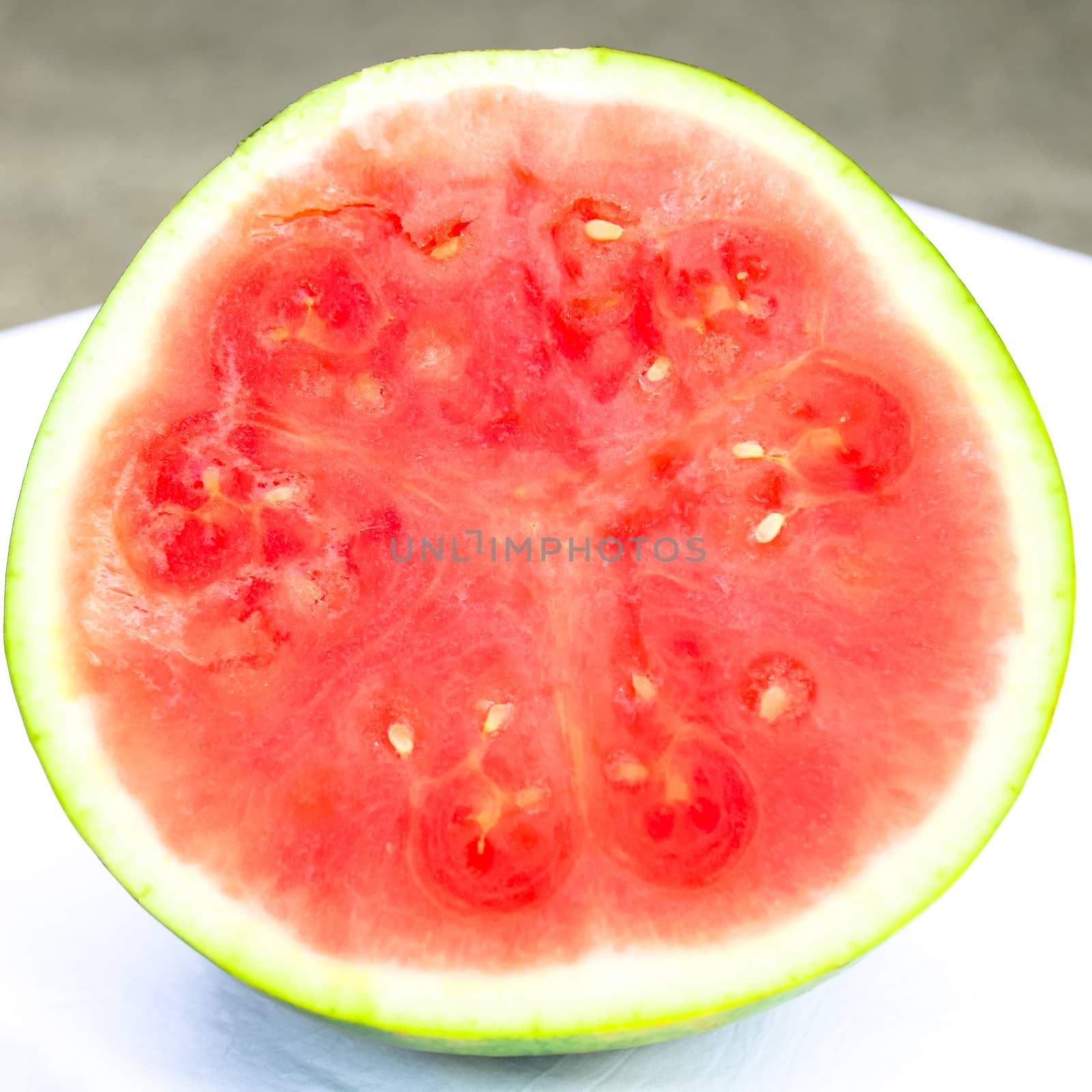 Studio shot half cut of organic watermelon isolated on white by trongnguyen