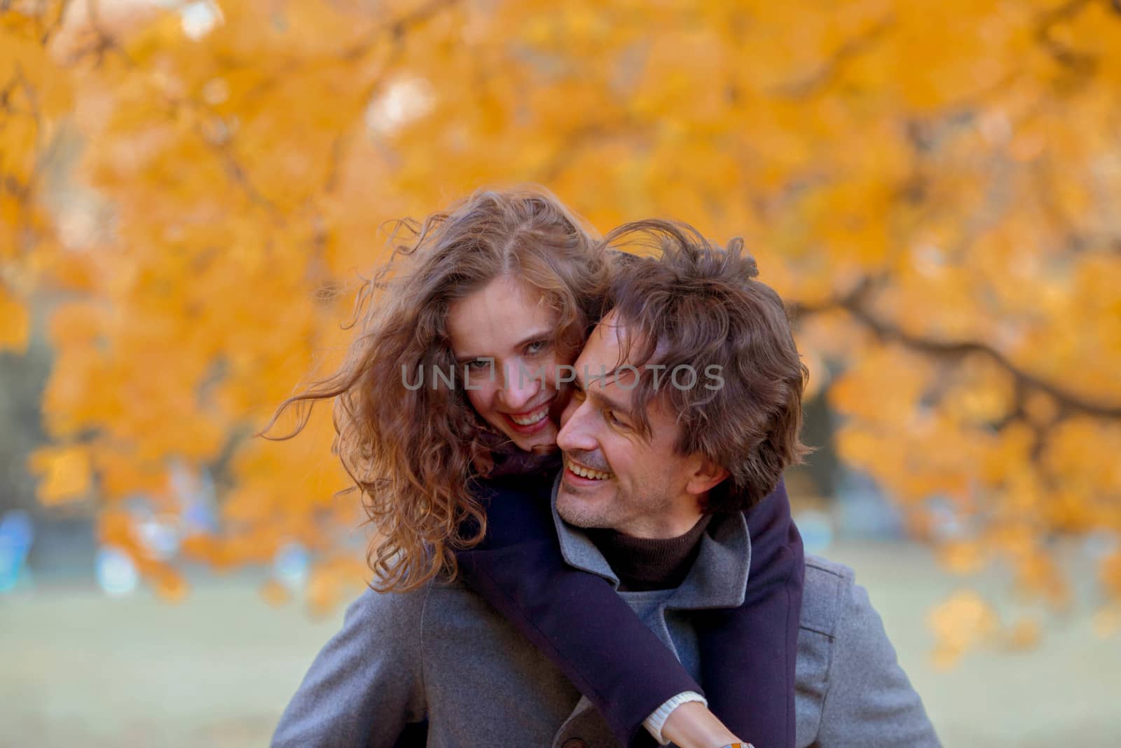 Couple in autumn park by ALotOfPeople