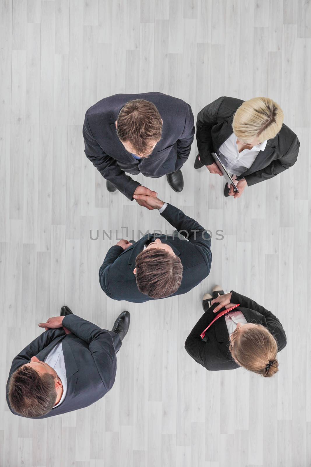 Business people shaking hand by ALotOfPeople