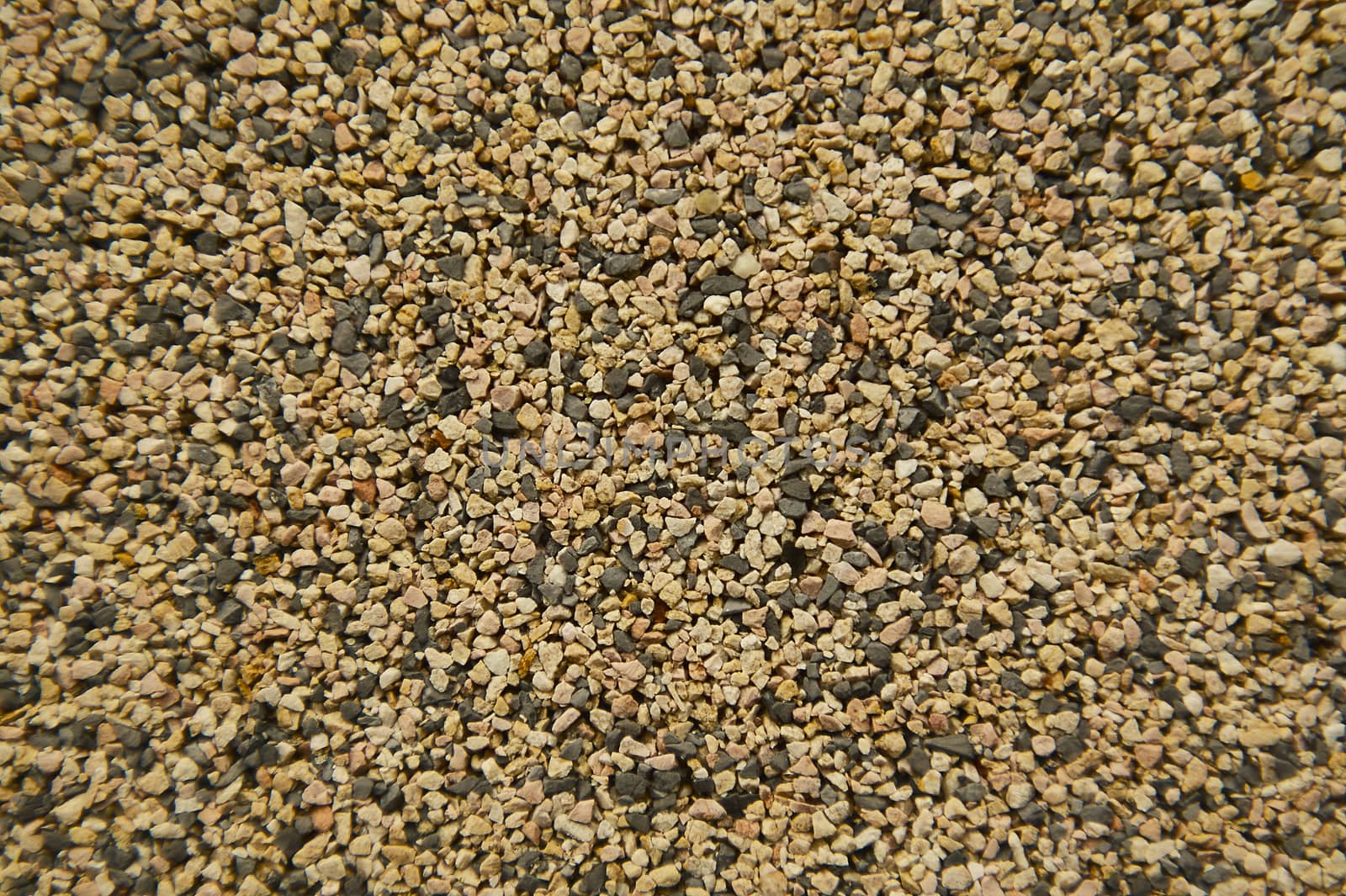 Detail of a texture of a wall covered with pebbles. Used in the Italian buildings of the 1960s.