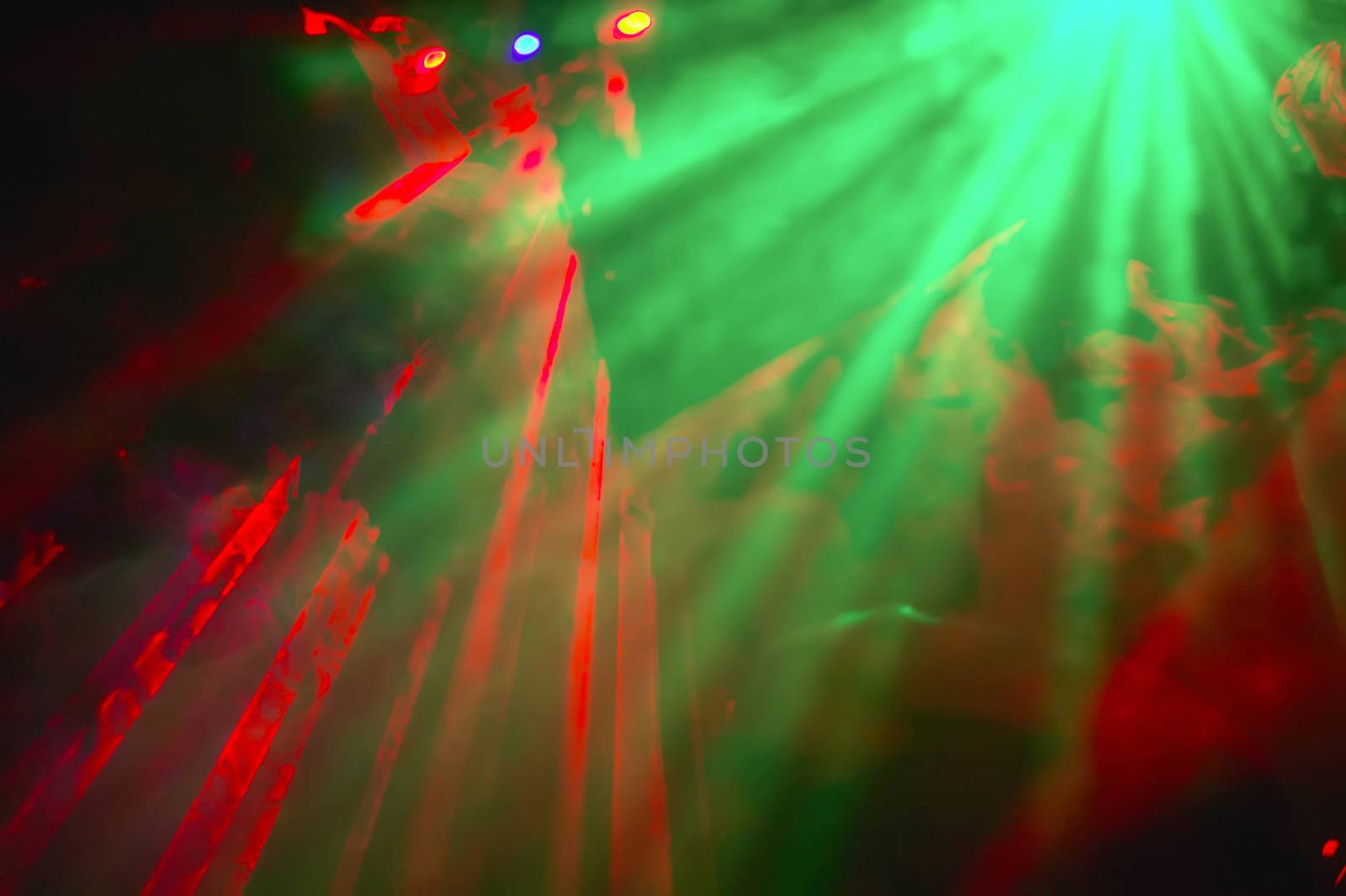 Shooting of colorful lights and psychedelics amid smoking effects in a disco. Drawing Texture Graphics.