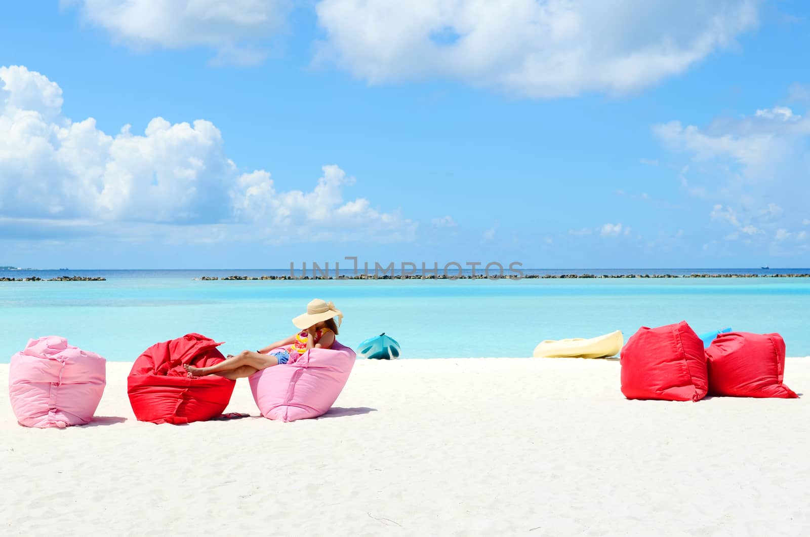 Portrait of happy young woman at  Maldives island. Travel and Vacation. 