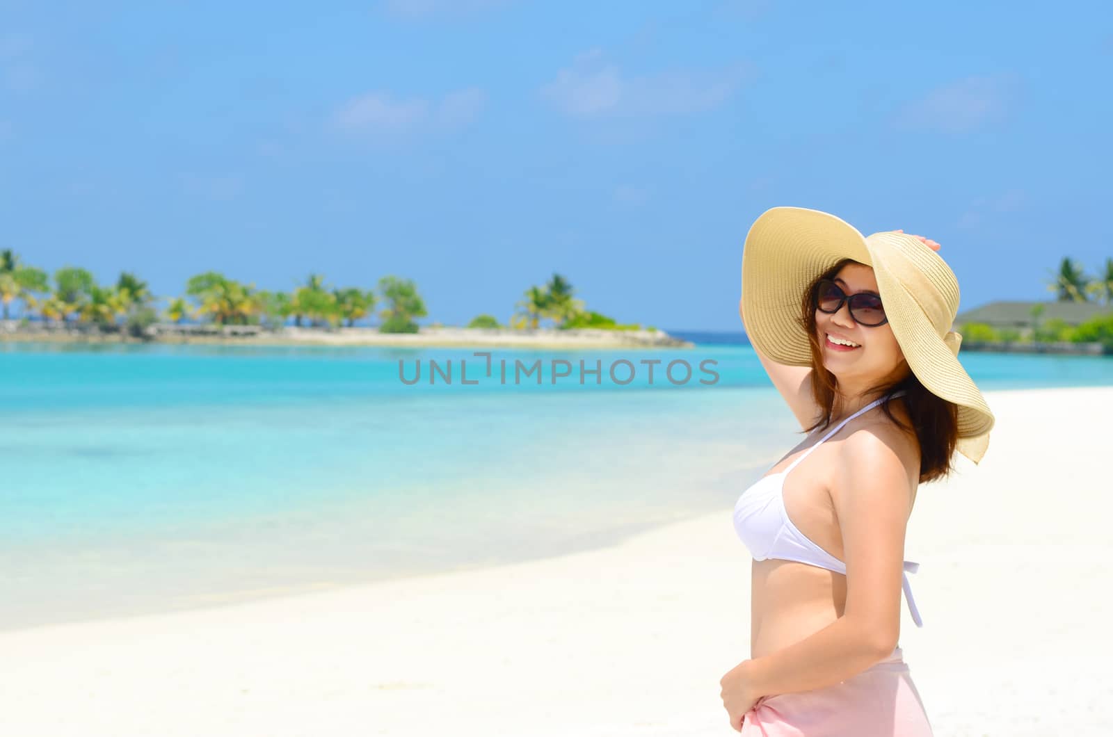 Portrait of happy and beautiful woman at  Maldives island. Travel and Vacation. 