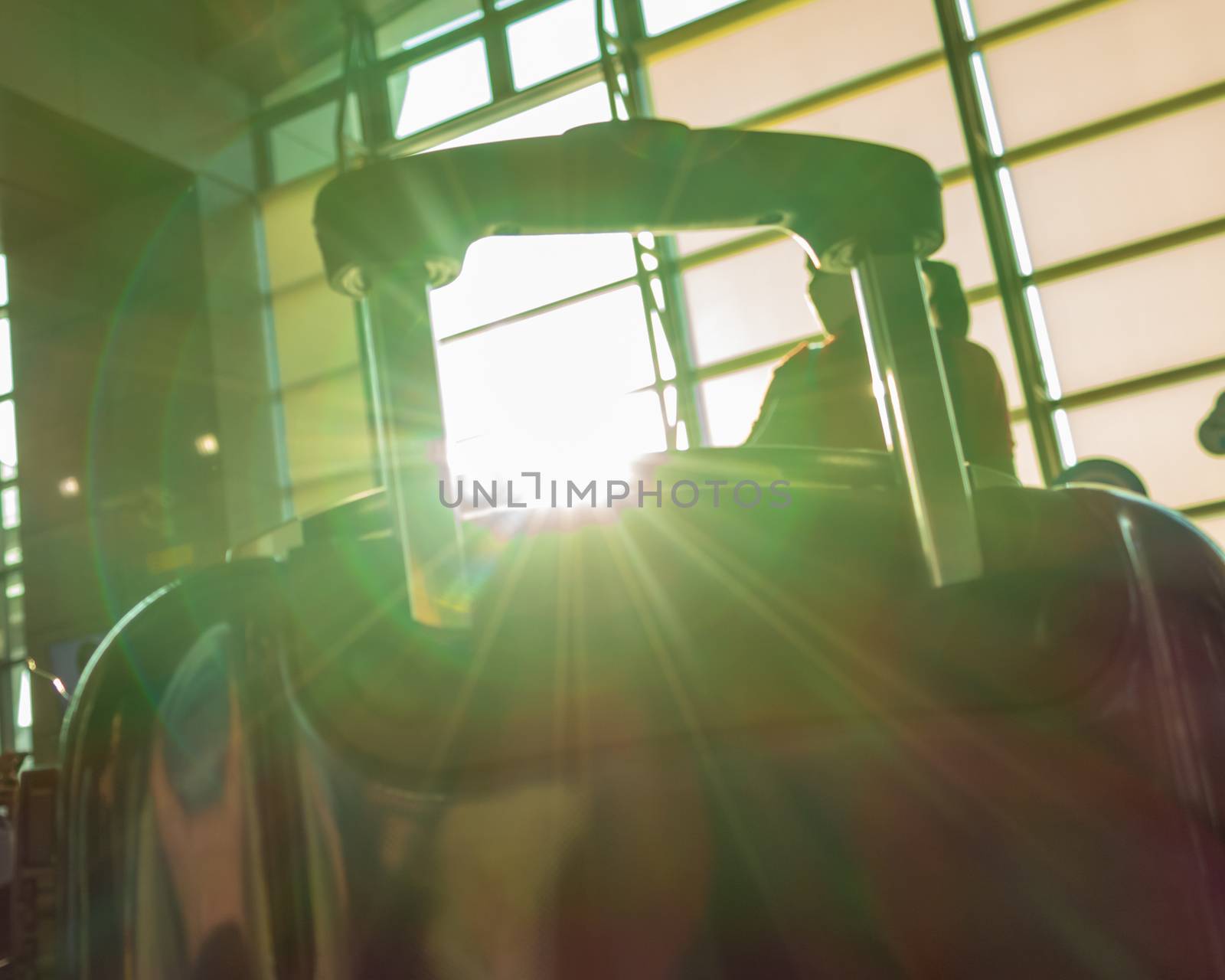 Lens flare through luggage handle, travel concept