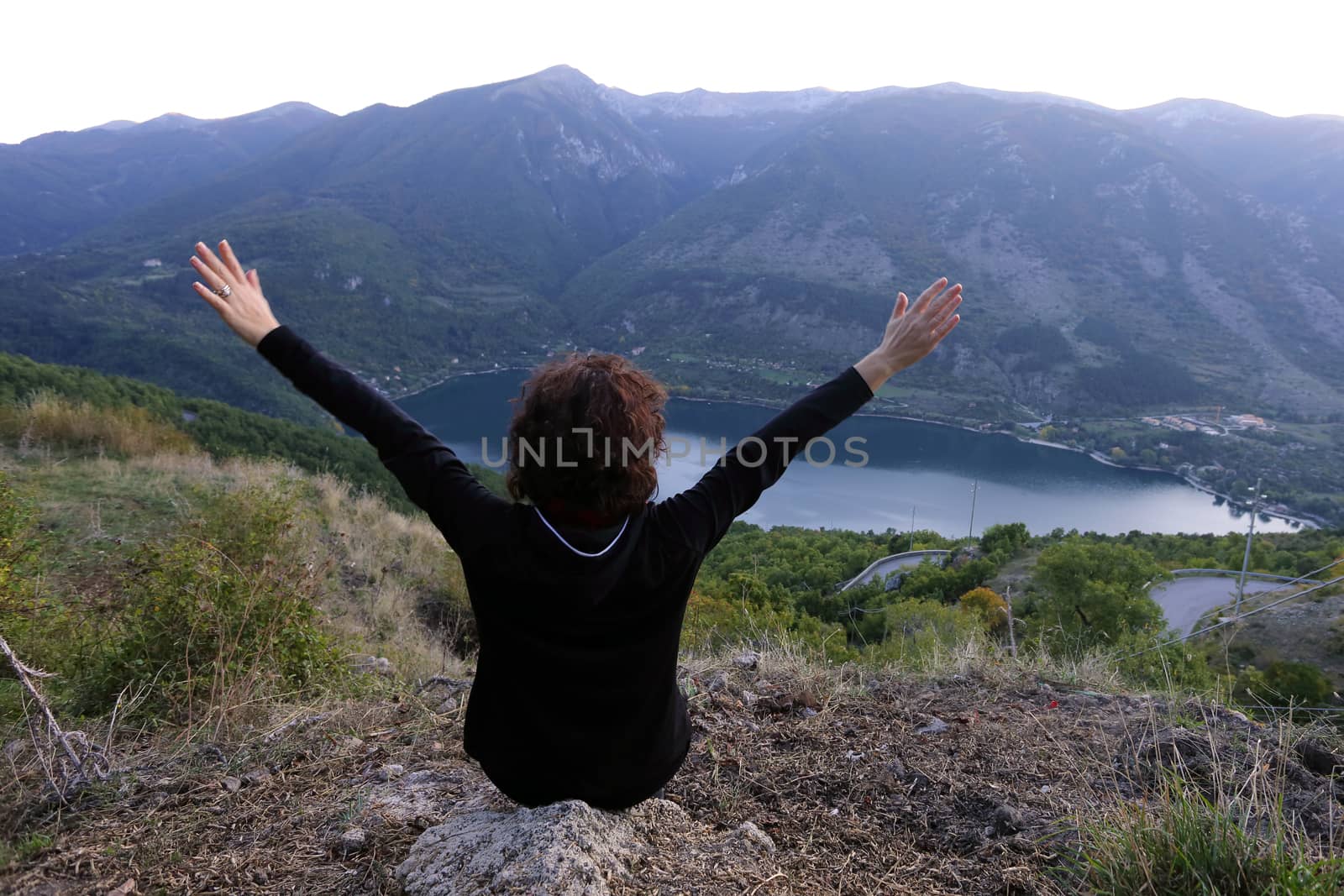 Scanno, Italy - October 12, 2019: The lake seen from Frattura with girl from behind by antonionardelli