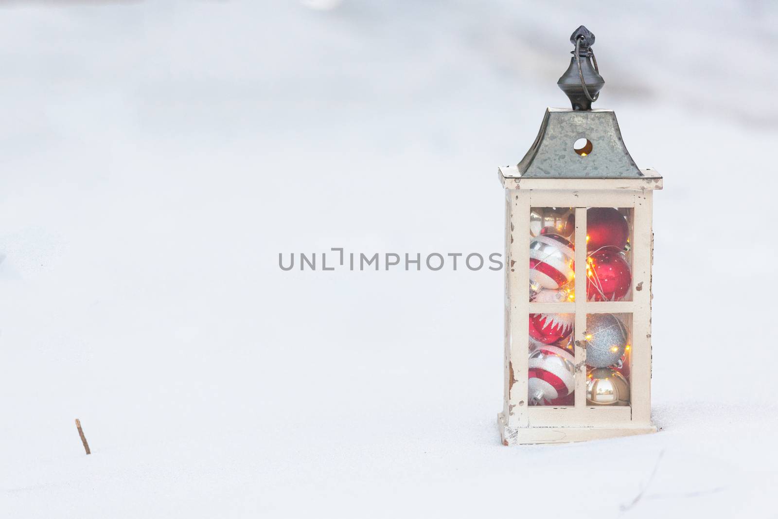 Christmas lantern in the snow.
