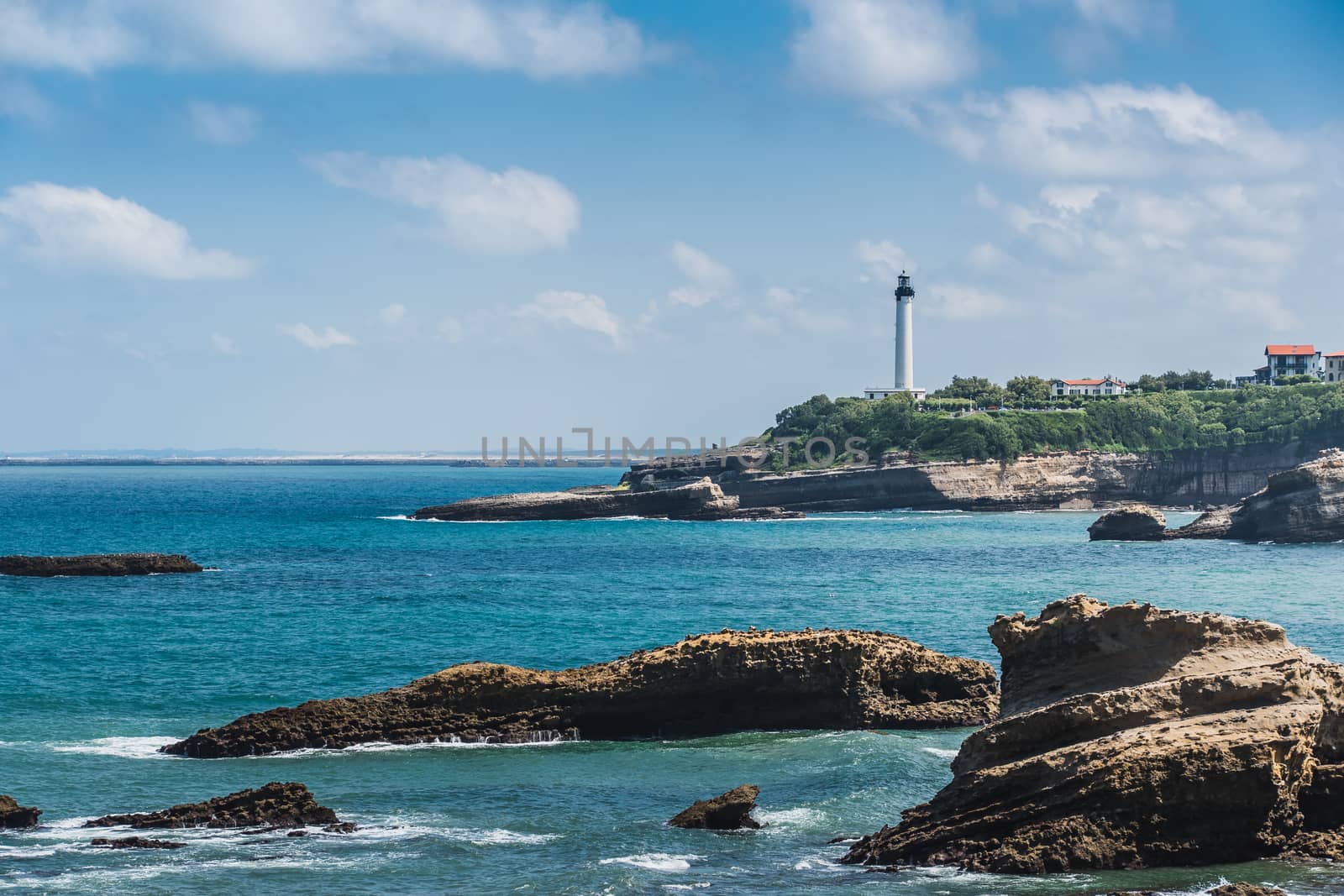 City of Biarritz with its lighthouse and these typical houses and old port in France