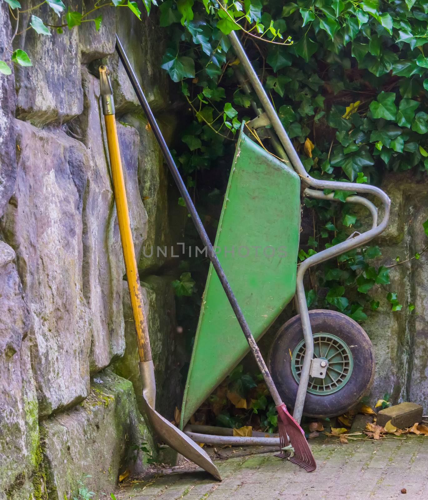 Basic gardening equipment, a wheelbarrow with a shovel and rigid, Garden upkeep tools