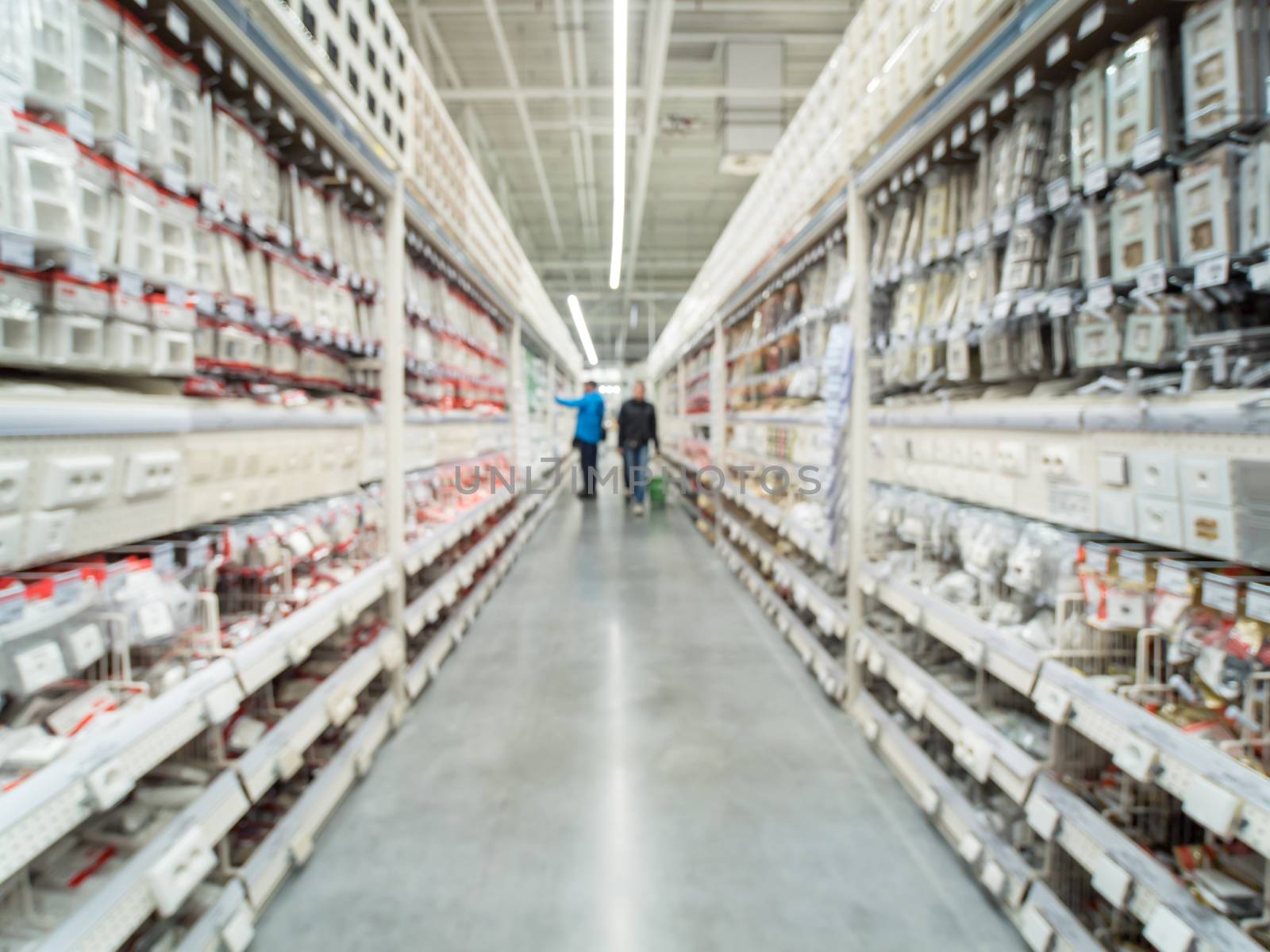 Abstract blurred store for home improvement and DIY. Warehouse aisle of building materials in industiral store. Blur