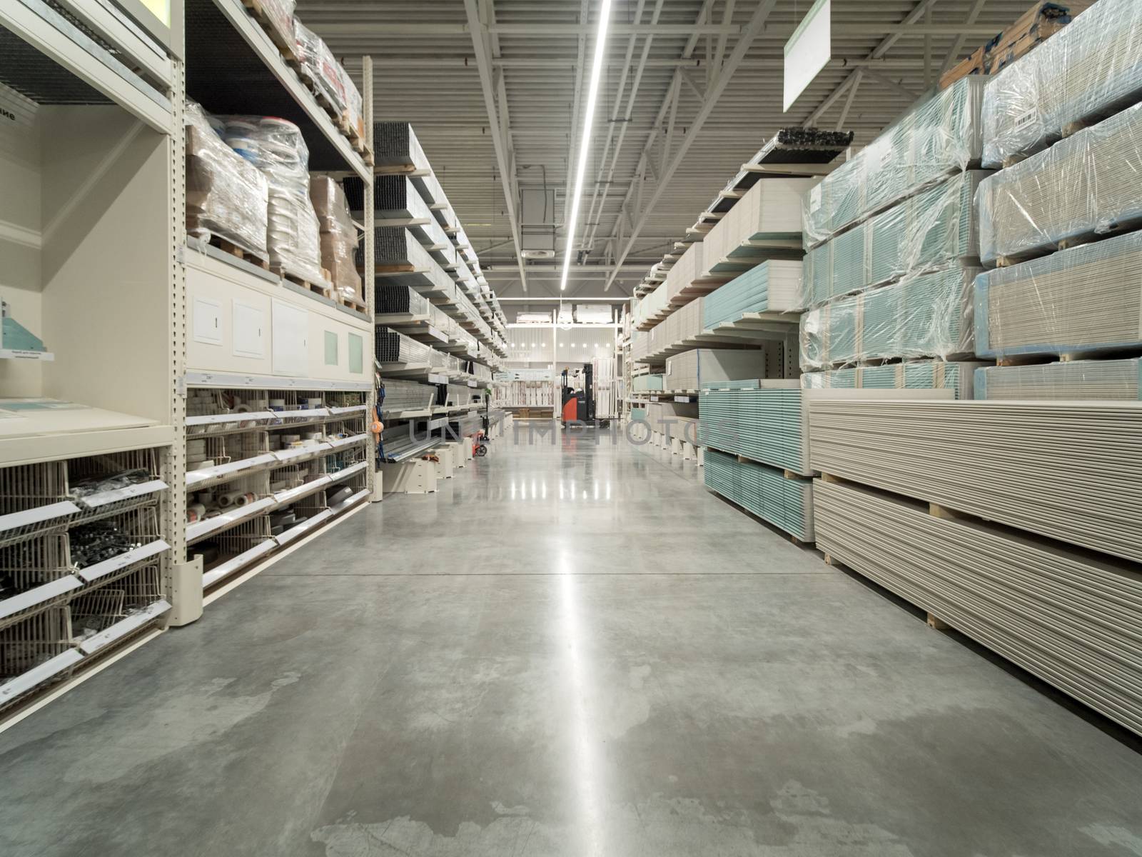 Store for home improvement and DIY. Warehouse aisle of building materials in industiral store. Shallow DOF