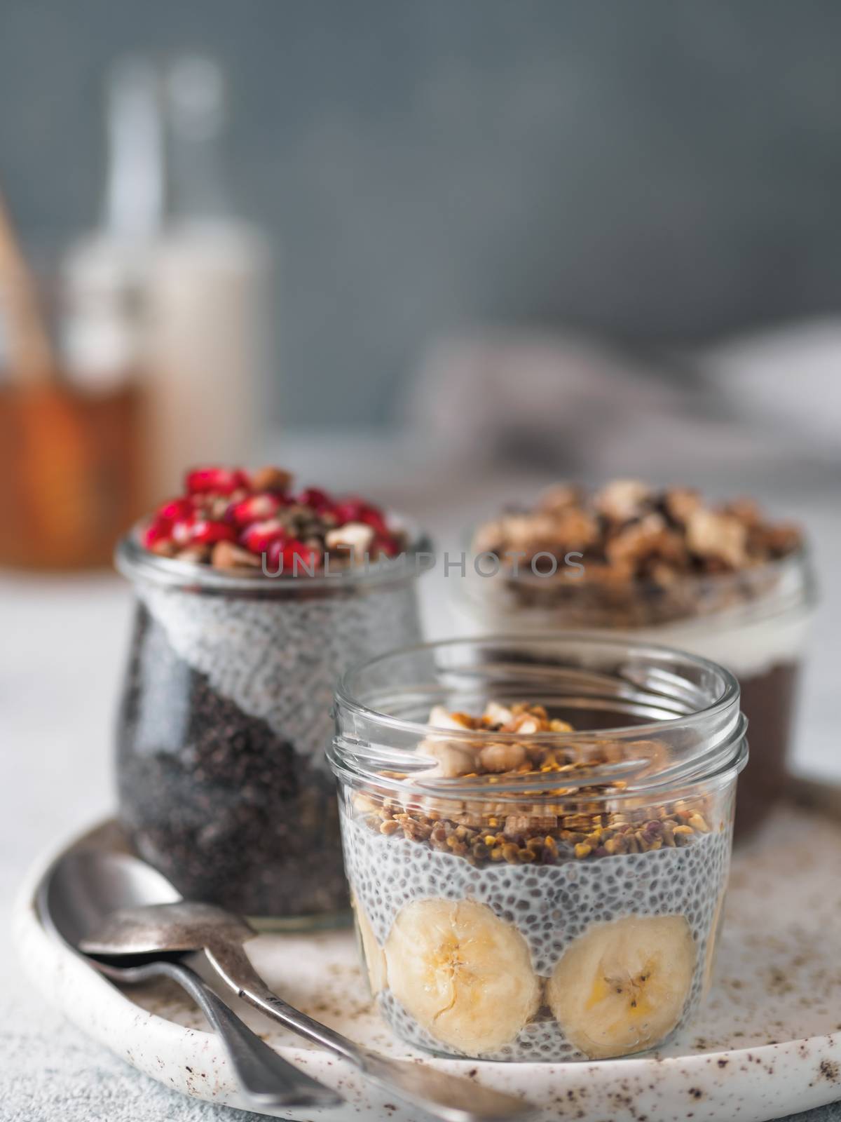 chia pudding set in different glass jars by fascinadora