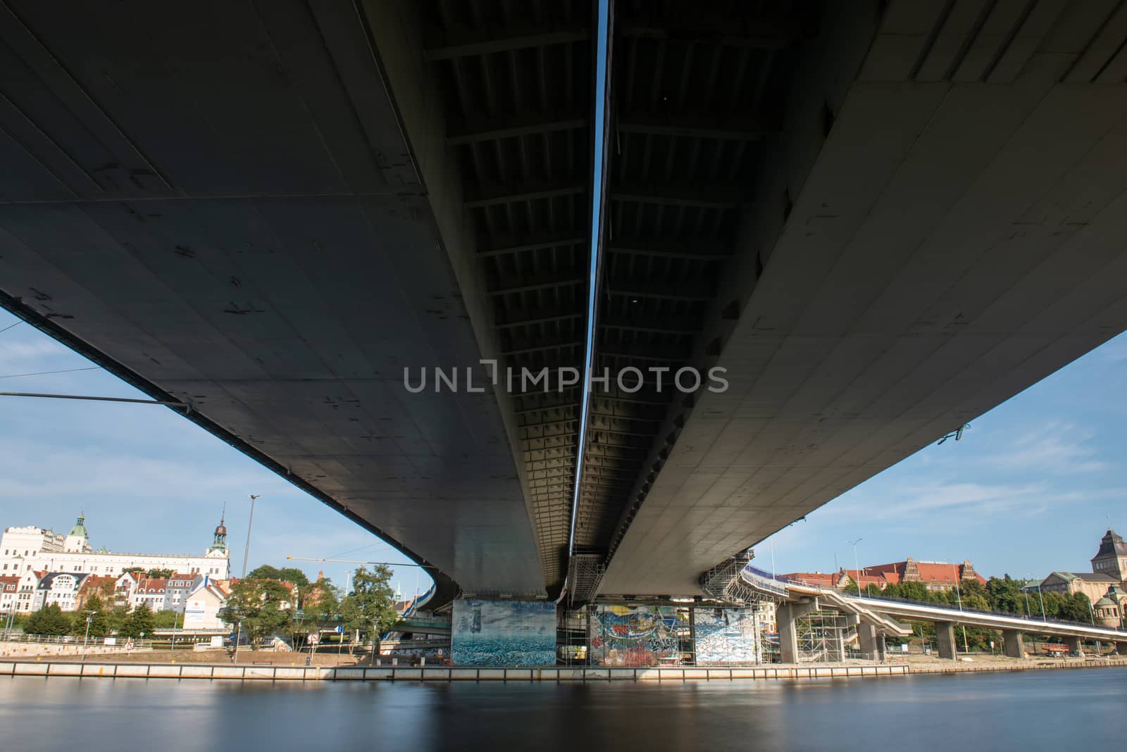 Left bank of the Oder river in Szczecin with the maritime museum and the Chrobry embankment, Szczecin, Poland. View under the bridge.