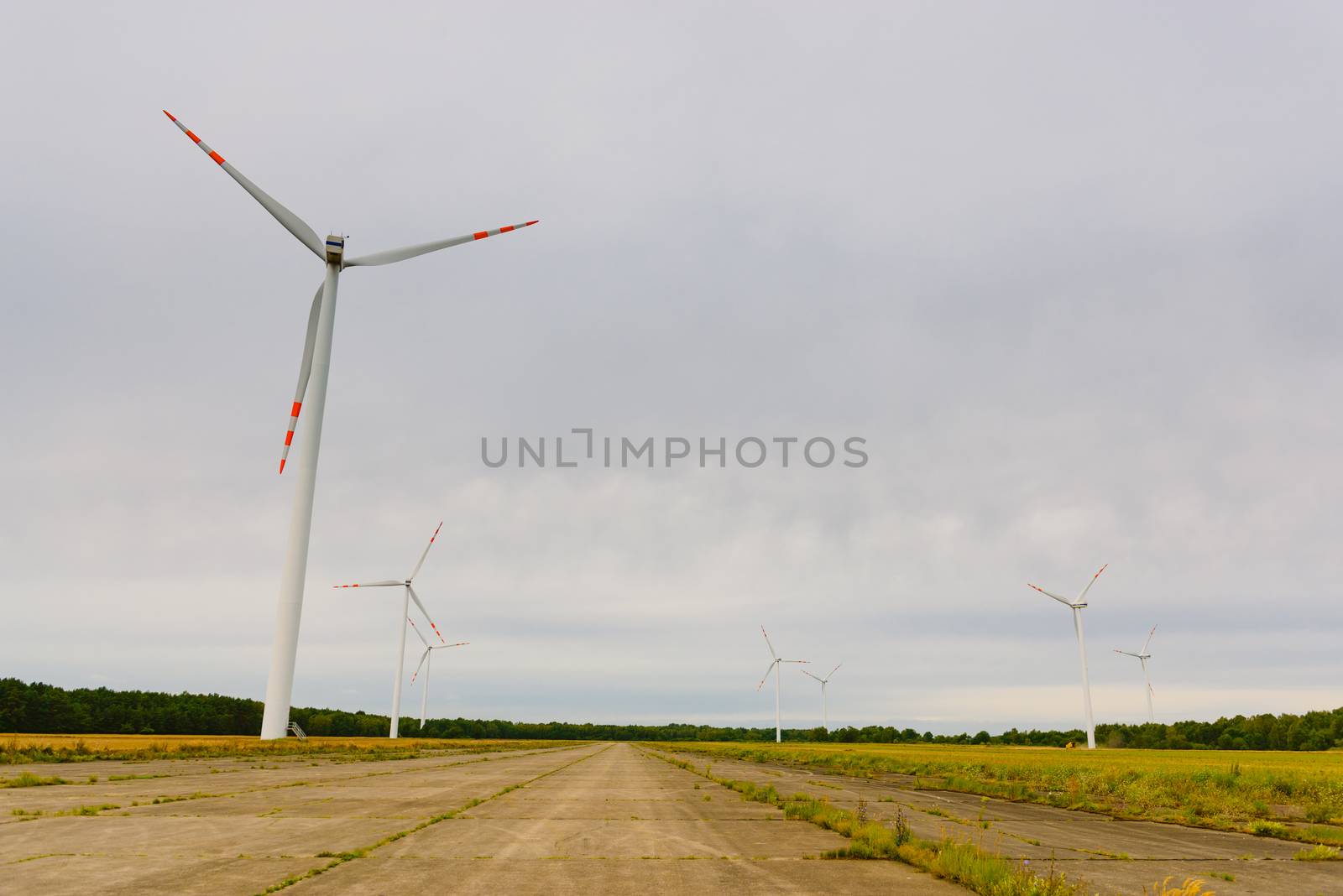 Windturbine. Eco power renewable energy production from wind. Windmill saves the earth's natural ingredients. Green ecology and pure electricity.