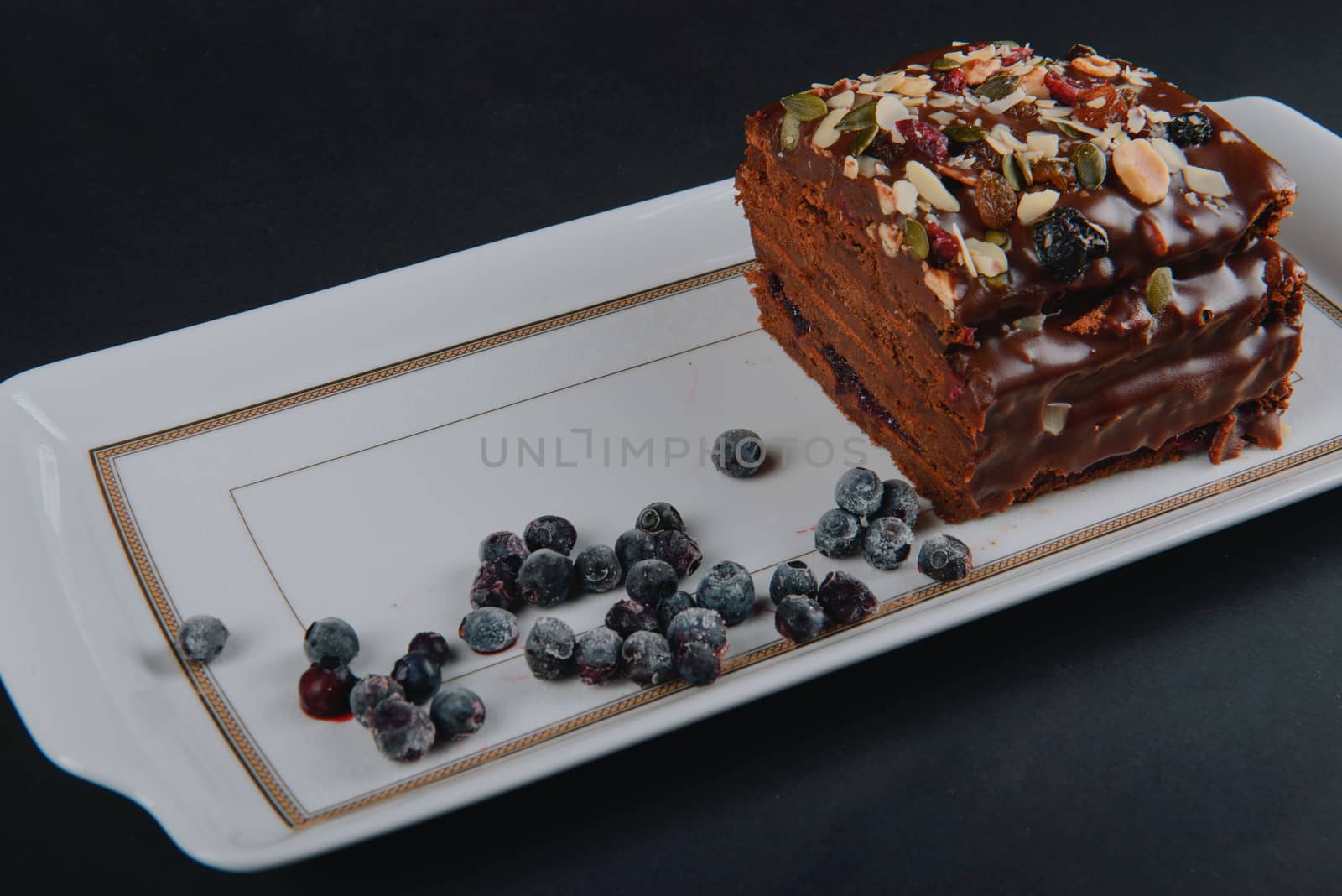 Chocolate cake with raisins lies on the table