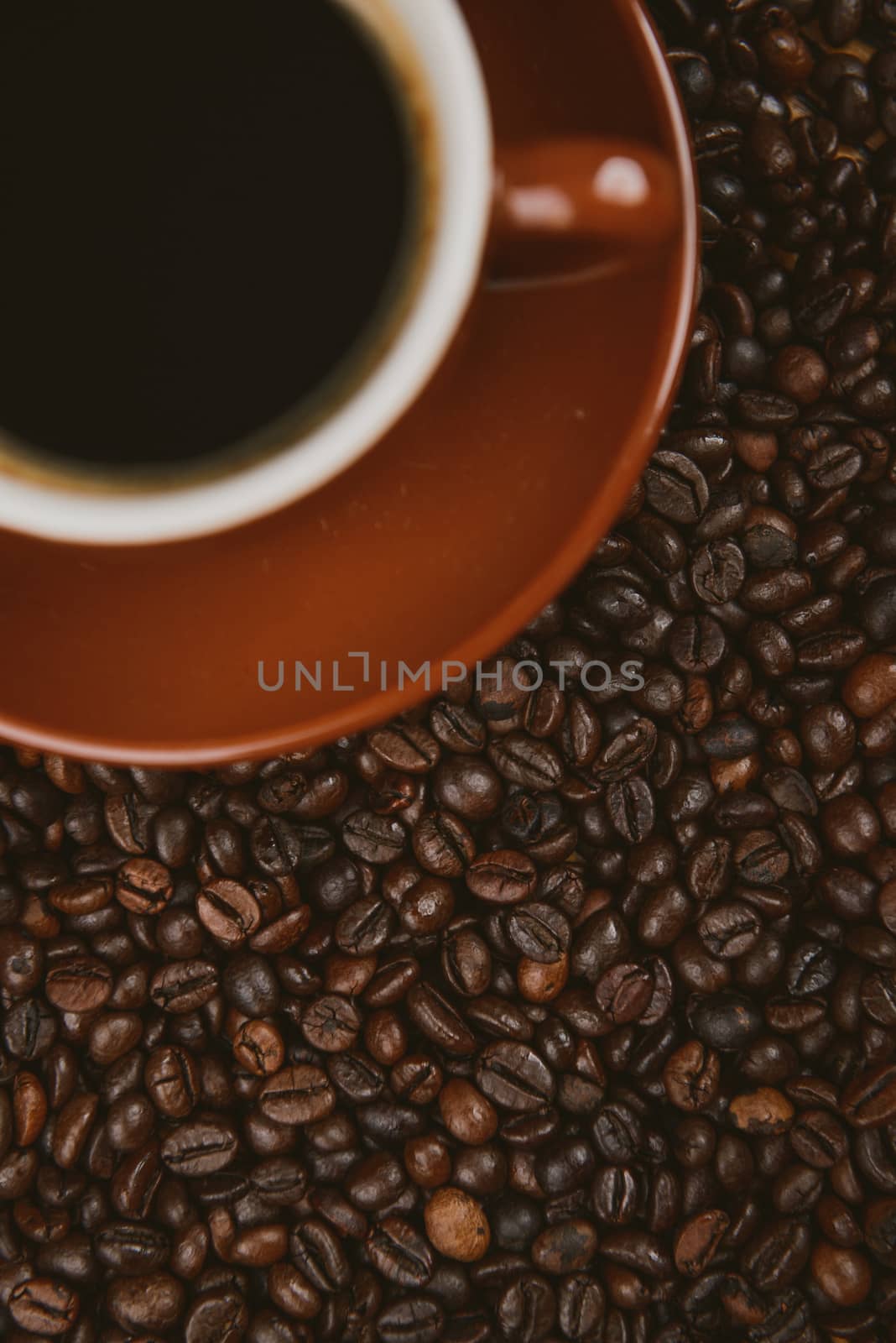 Coffee cup and beans on a background