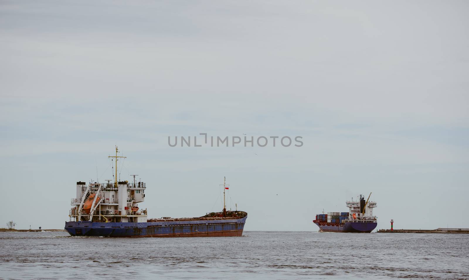 Transport vessels depart from the port in Swinoujscie to the open Baltic Sea