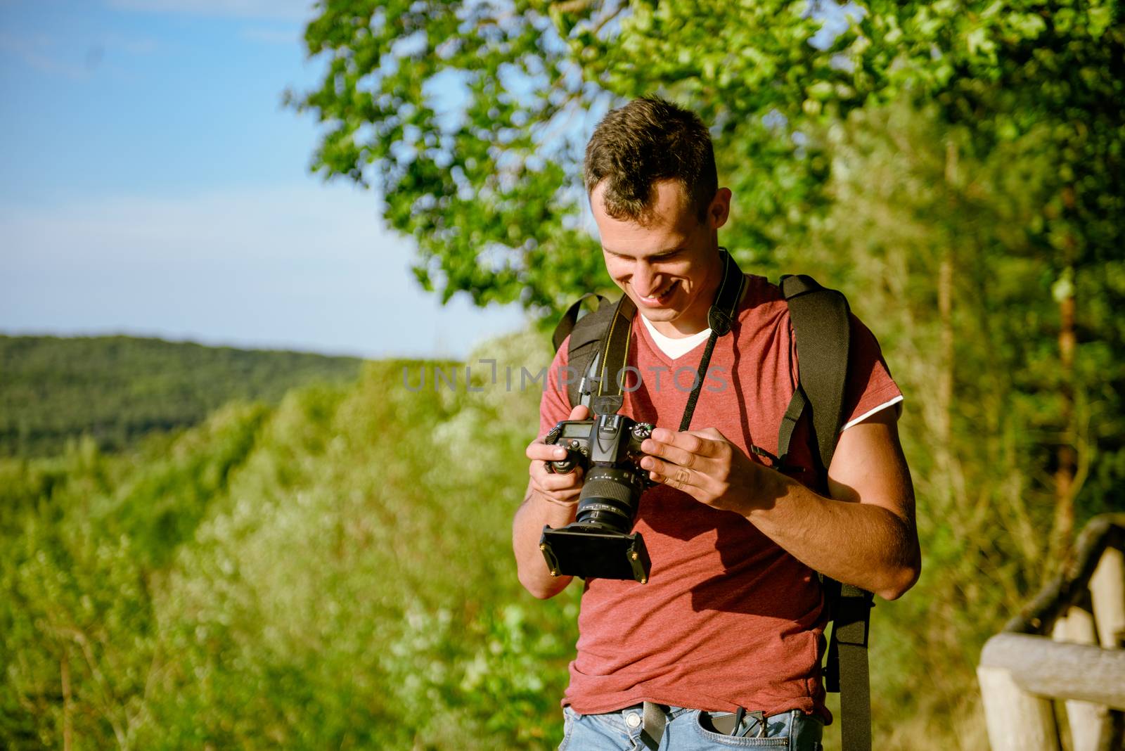 Photographer's boyfriend takes a photo. Summer season. Nature and landscape photography