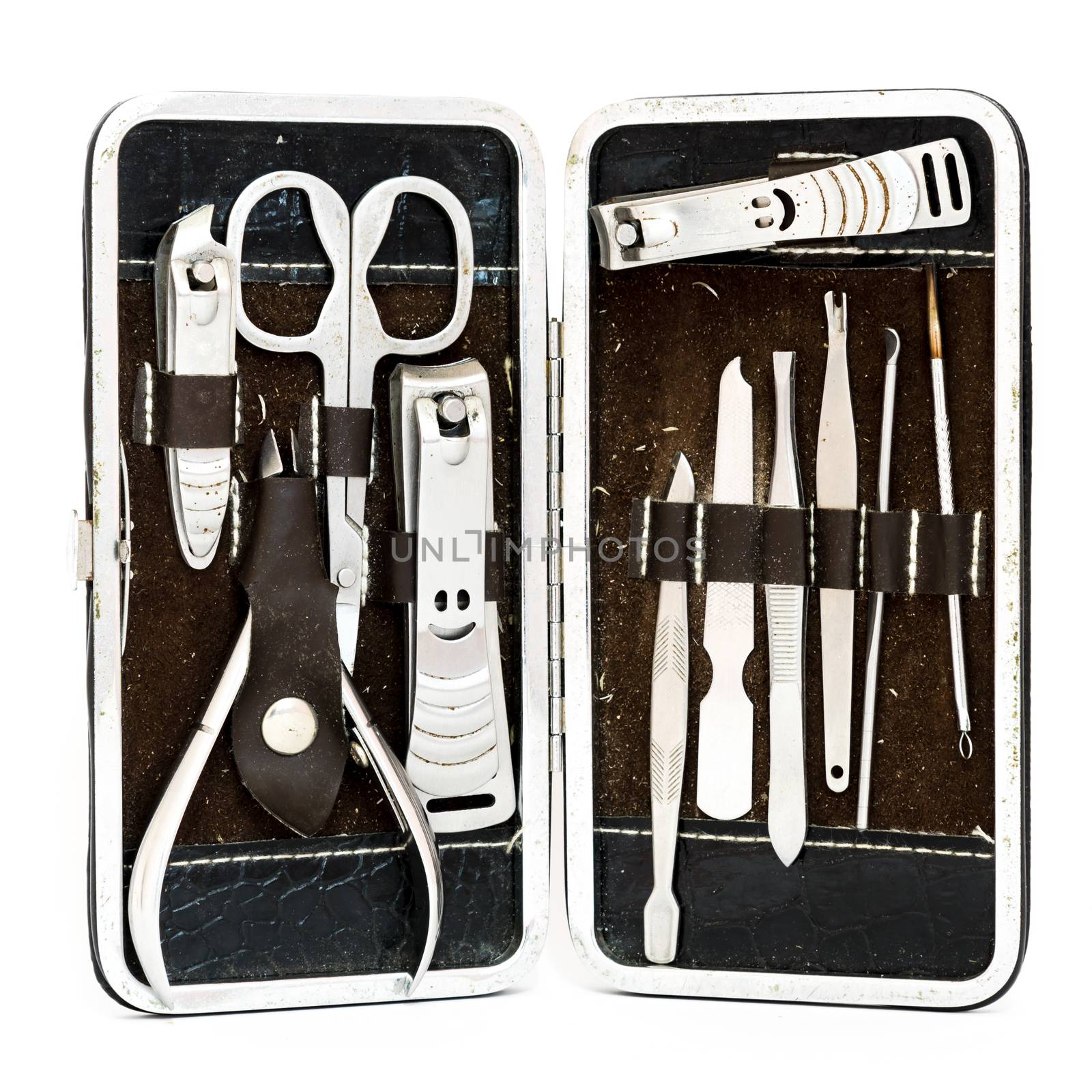 Studio shot top view grooming kit and nail tools in travel case isolated on white by trongnguyen