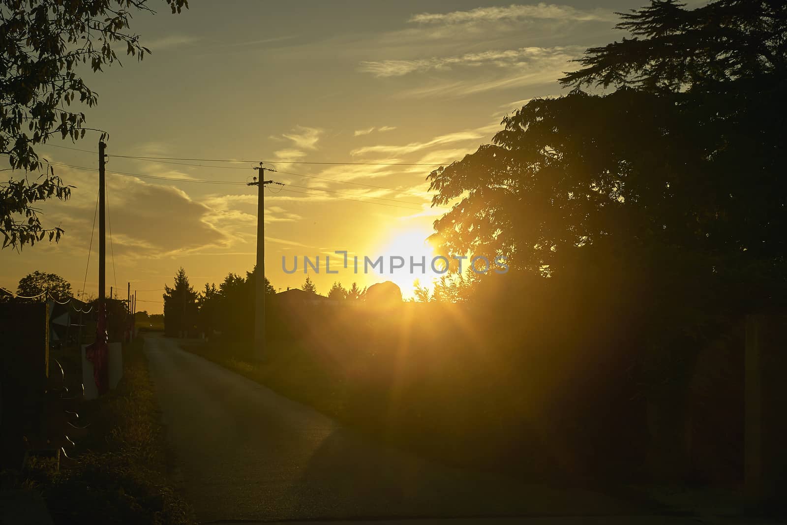 sunset in a country road by pippocarlot