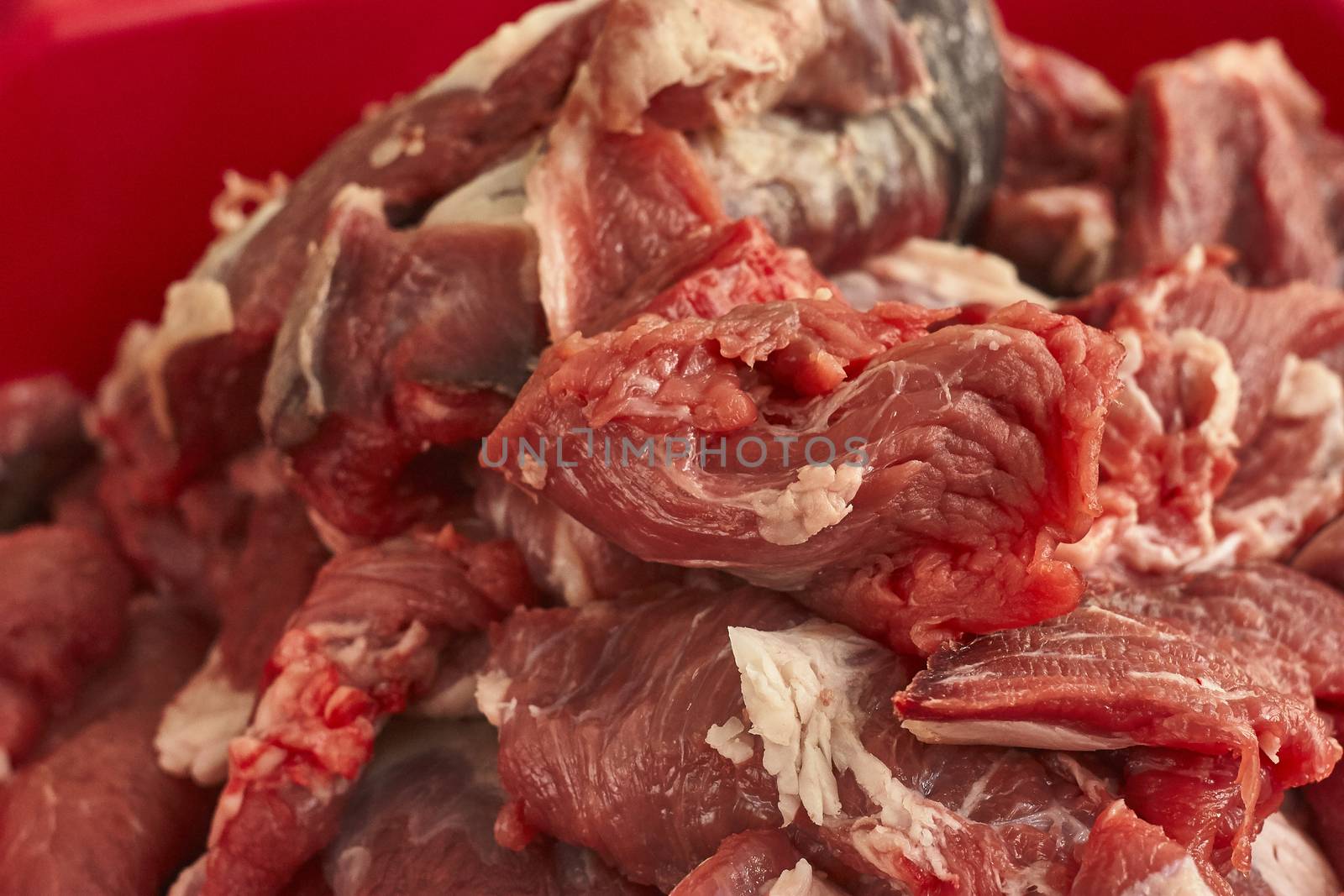 Detail of the fibers of a cut of veal with macro shot made in a butcher shop. Red meat from organic farming.