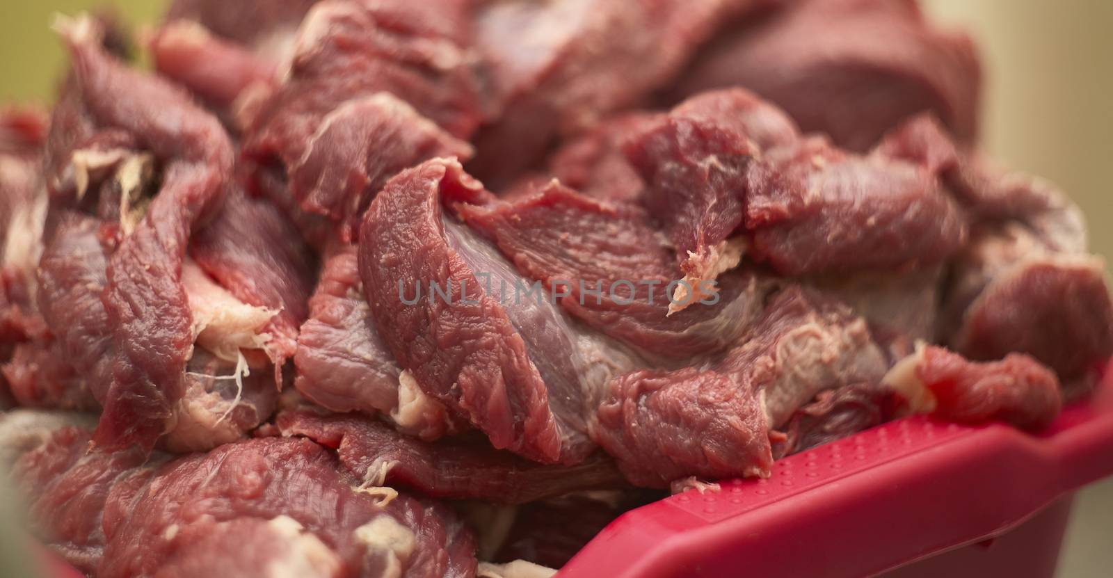 Detail of the fibers of a cut of veal with macro shot made in a butcher shop. Red meat from organic farming.