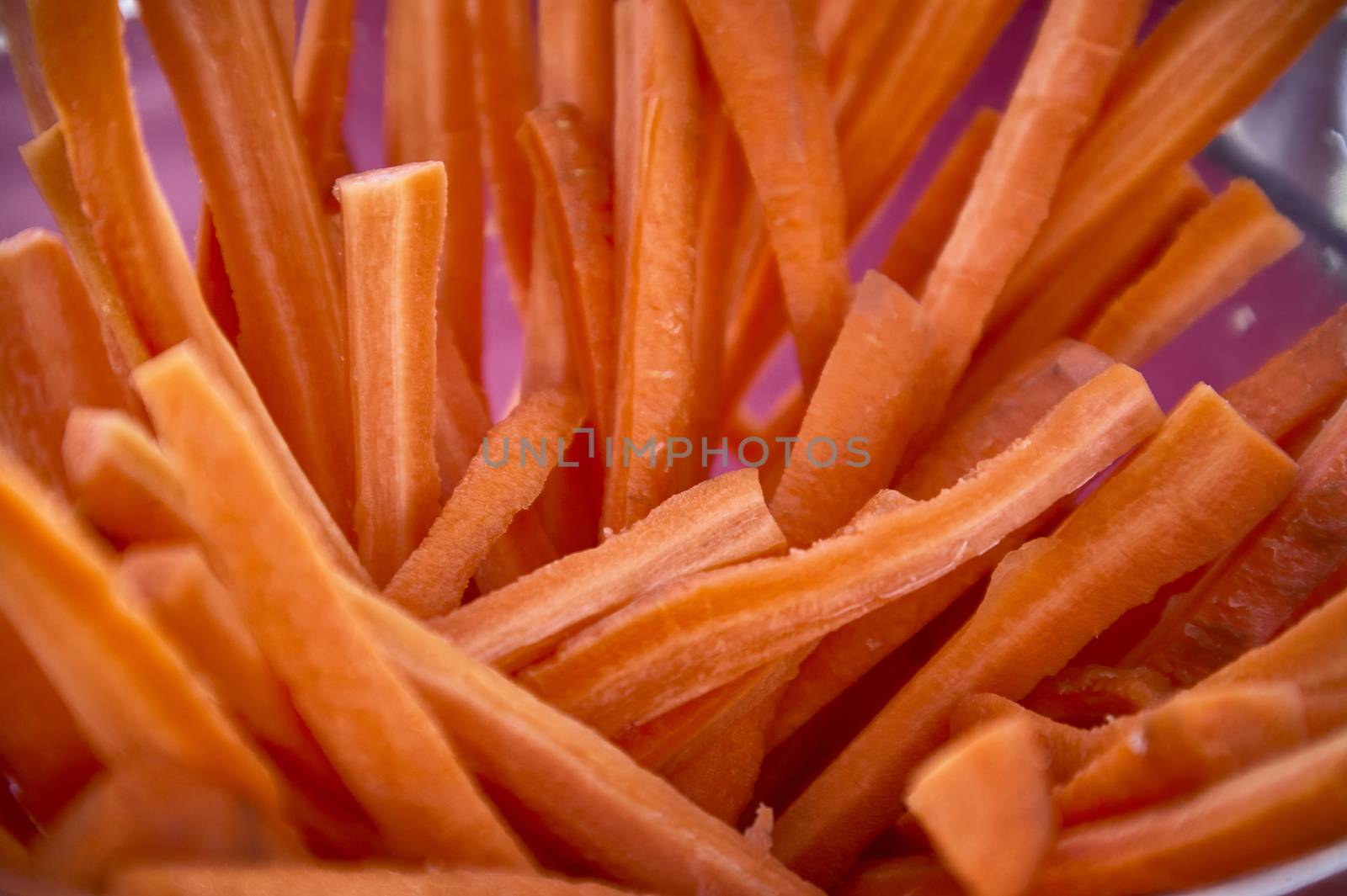 Carrots sliced in julienne and arranged in an artistic composition to embellish the table for a lunch or aperitif.