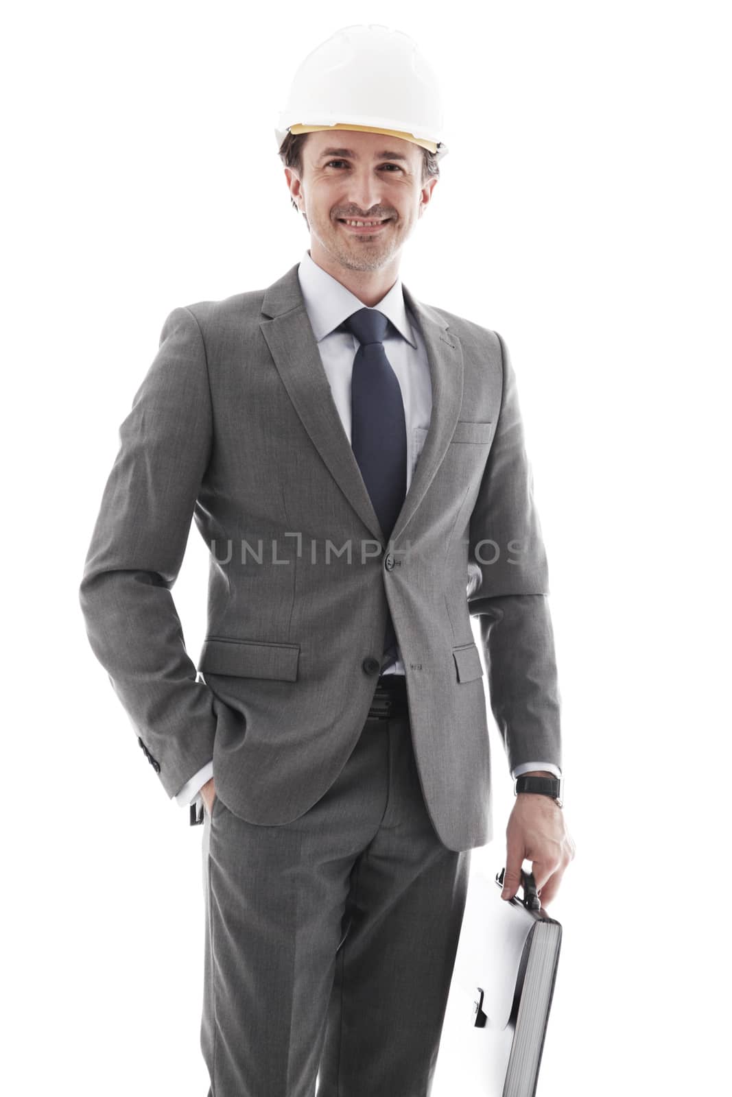 Young businessman in helmet isolated on white background