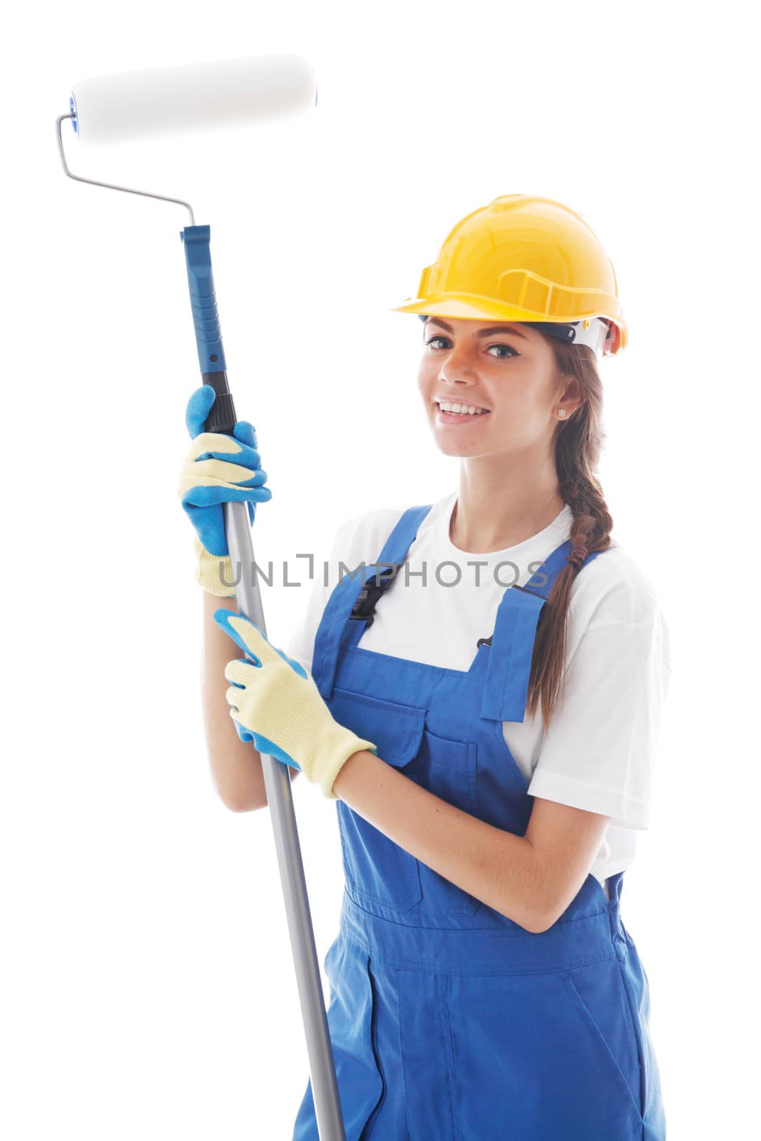 Young beautiful handywoman with paint roller isolated on white